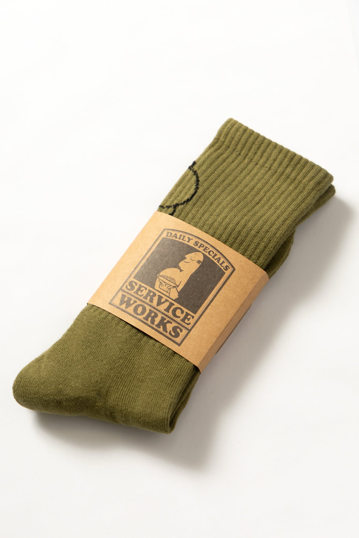Close-up view of olive green salt and pepper socks showing texture and fabric detail