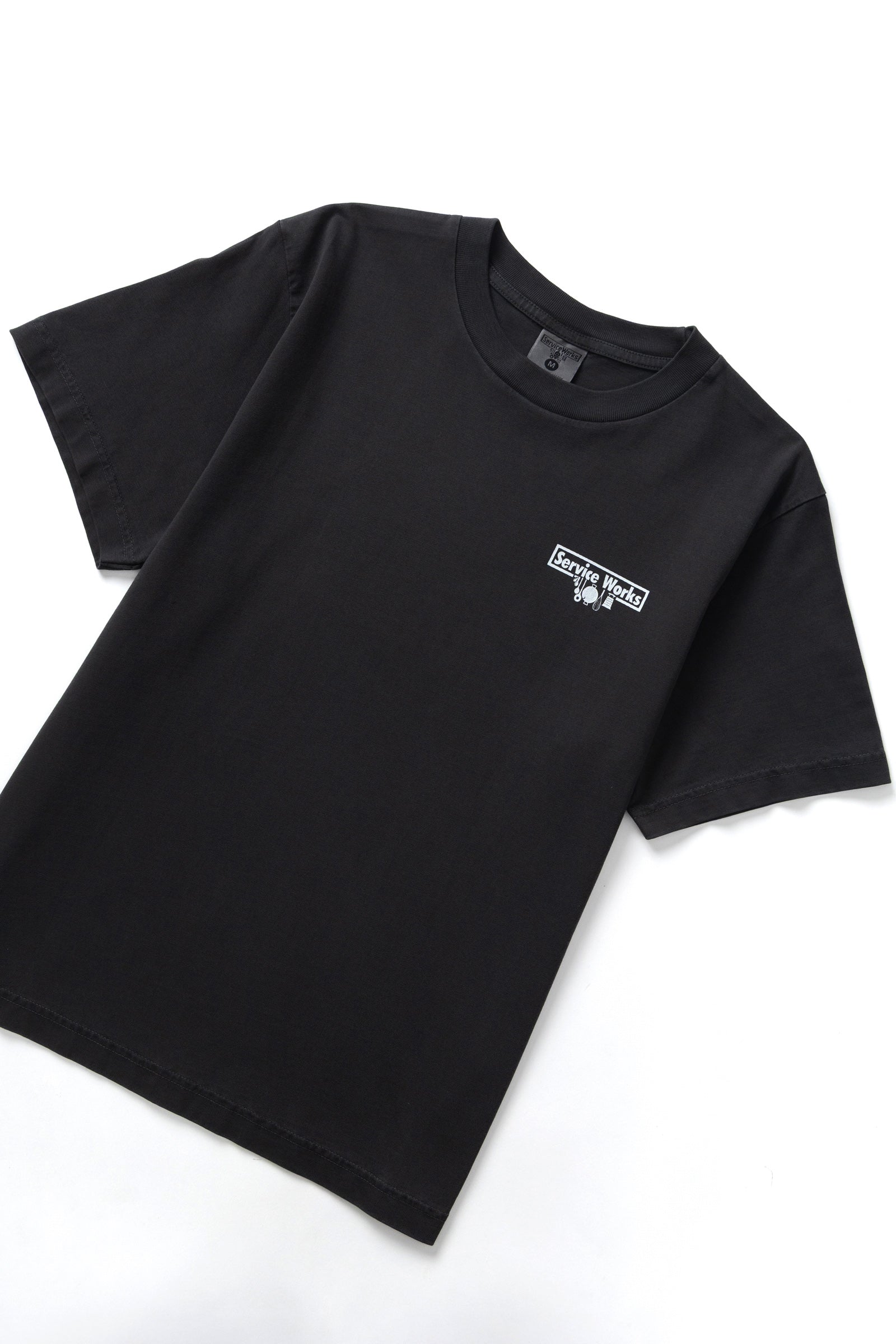 Black pigment dyed trademark tee side view premium vintage streetwear oversized fit washed cotton t-shirt