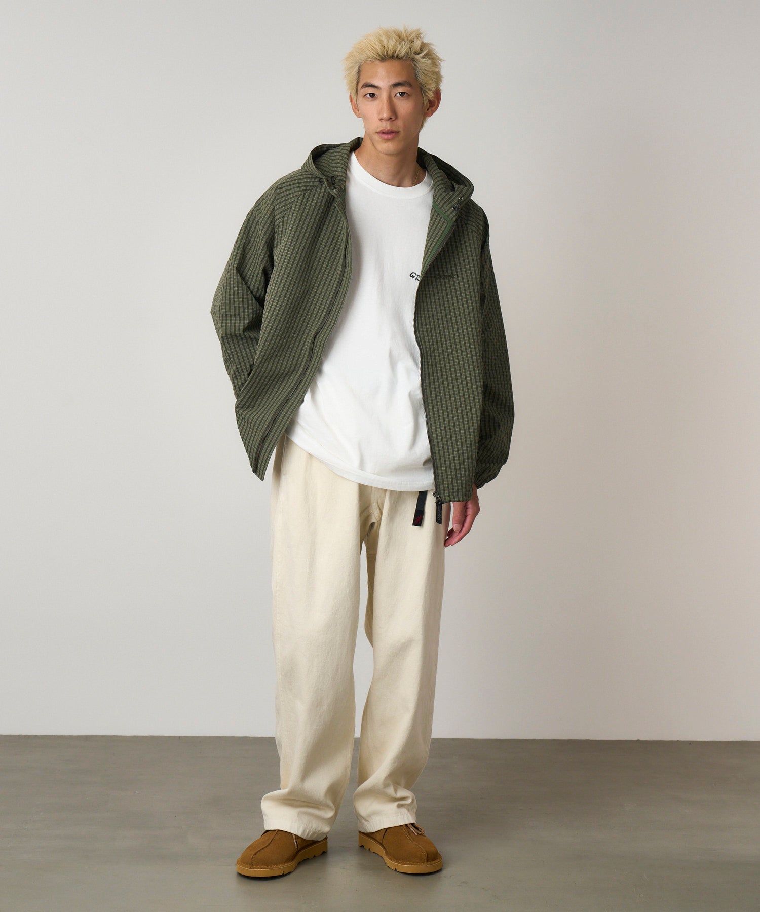 Model wearing bone hemp Gramicci-style straight fit pants with elastic waistband and cinch belt, lightweight durable twill fabric for everyday wear