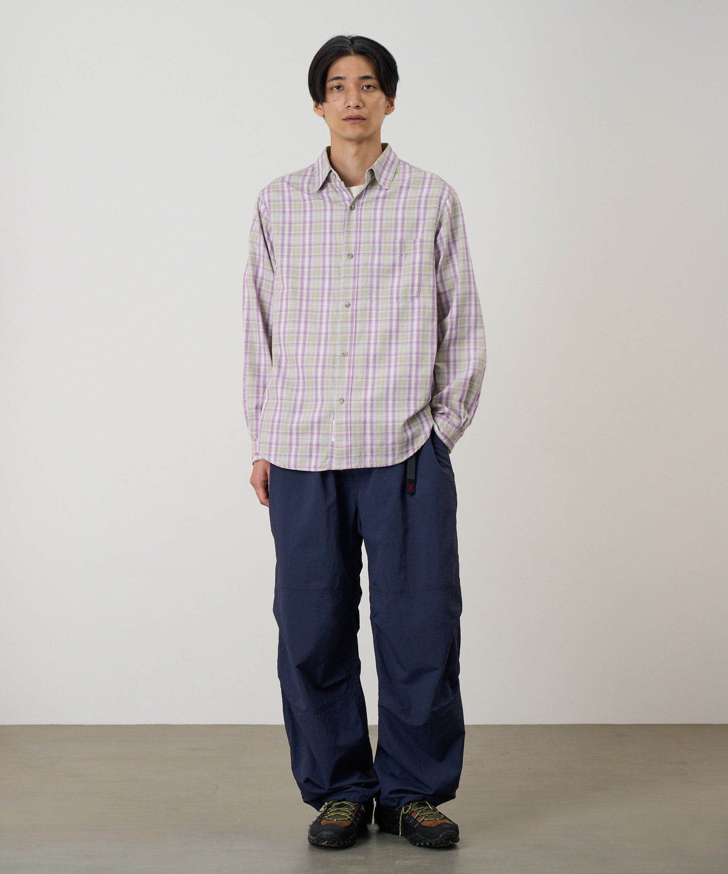 Men’s purple checkered ombre shirt on model, featuring a relaxed fit, chest pocket, and lightweight 100% cotton fabric