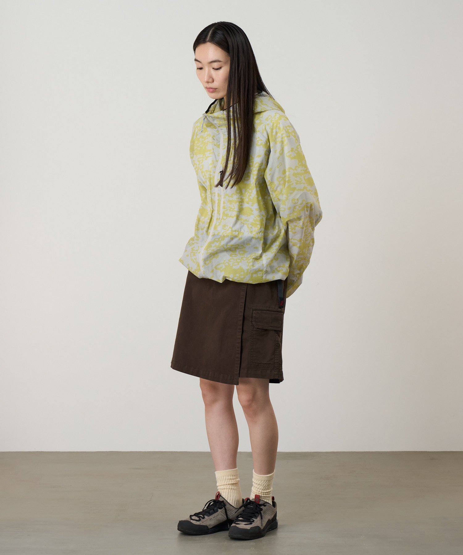 Side view of model wearing G-Skort in Chocolate