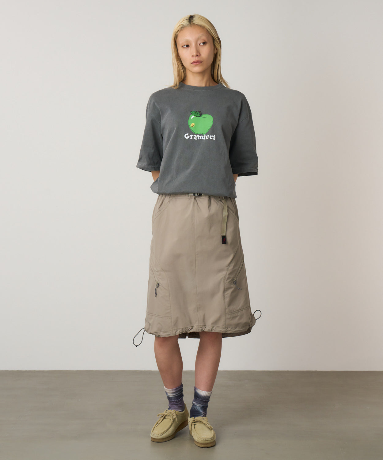 Gramicci Apple Tee in Charcoal Pigment worn on model showing relaxed streetwear fit