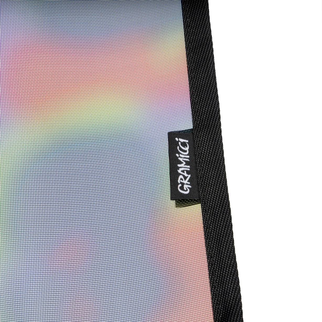 Detail view of Gramicci & Helinox Chair One in camo showing lightweight frame construction and tie-dyed mesh fabric design
