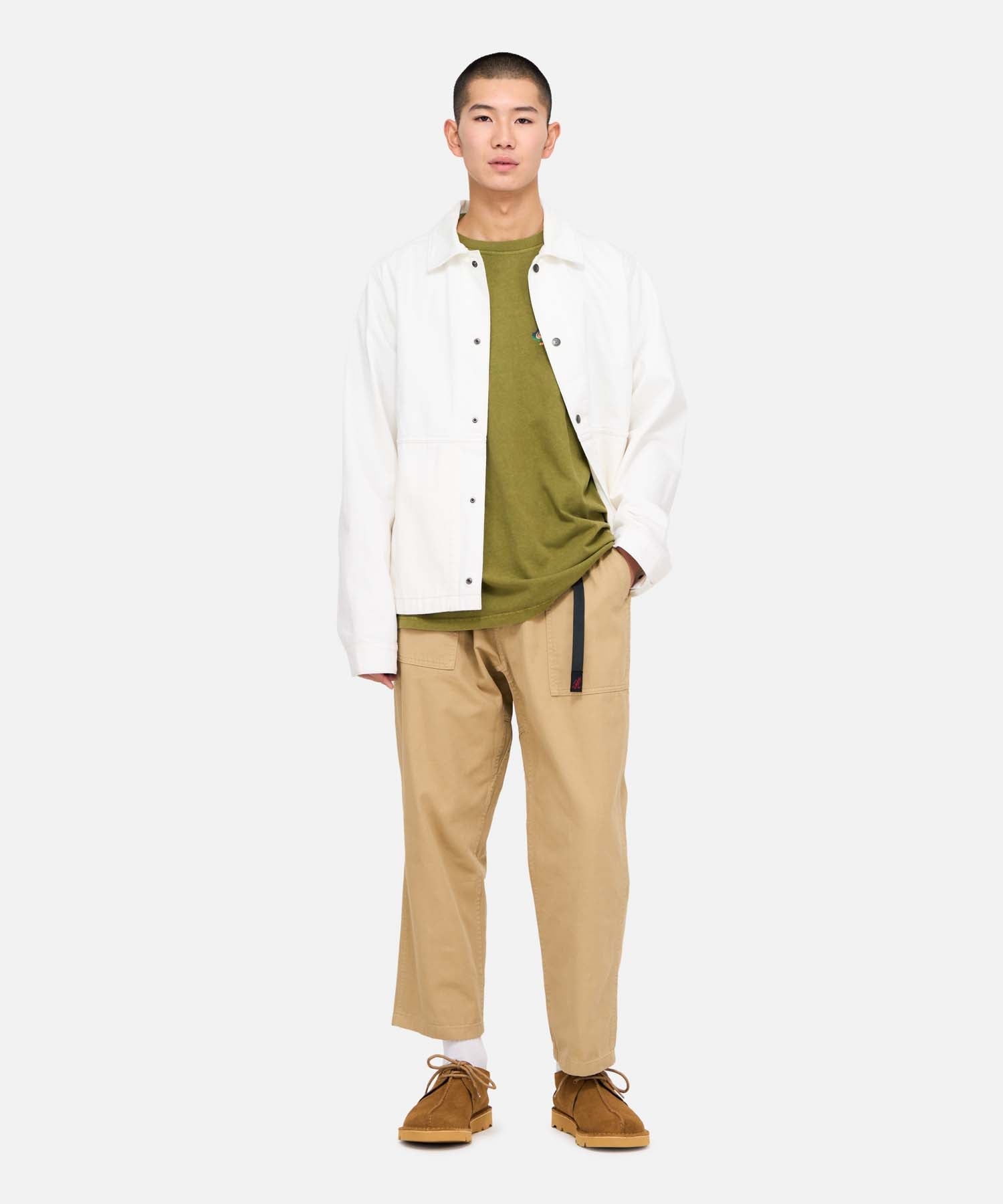 Side view of model wearing Gramicci Loose Tapered Pant US Chino with relaxed fit, eco cotton twill fabric and tapered cropped leg for everyday comfort.