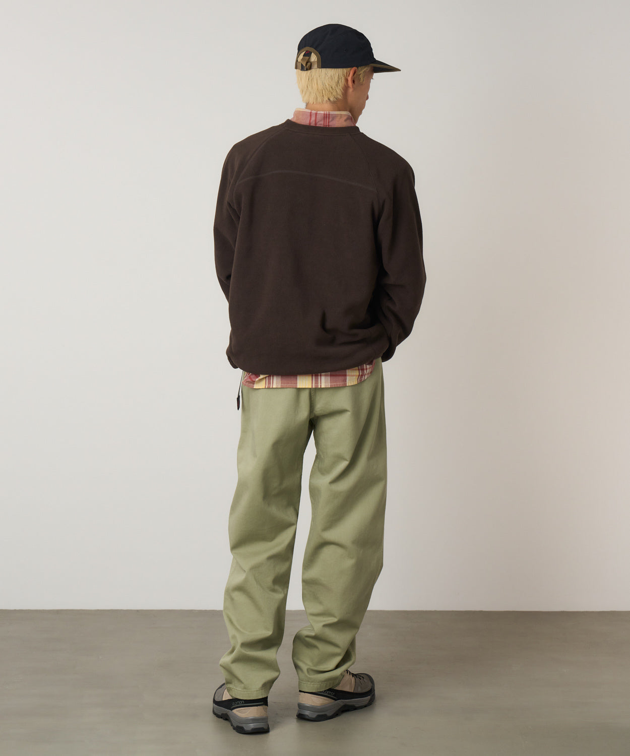 Model wearing Gramicci Pant Cactus Pigment relaxed fit cotton twill pants with cinch belt by LE.SHOP