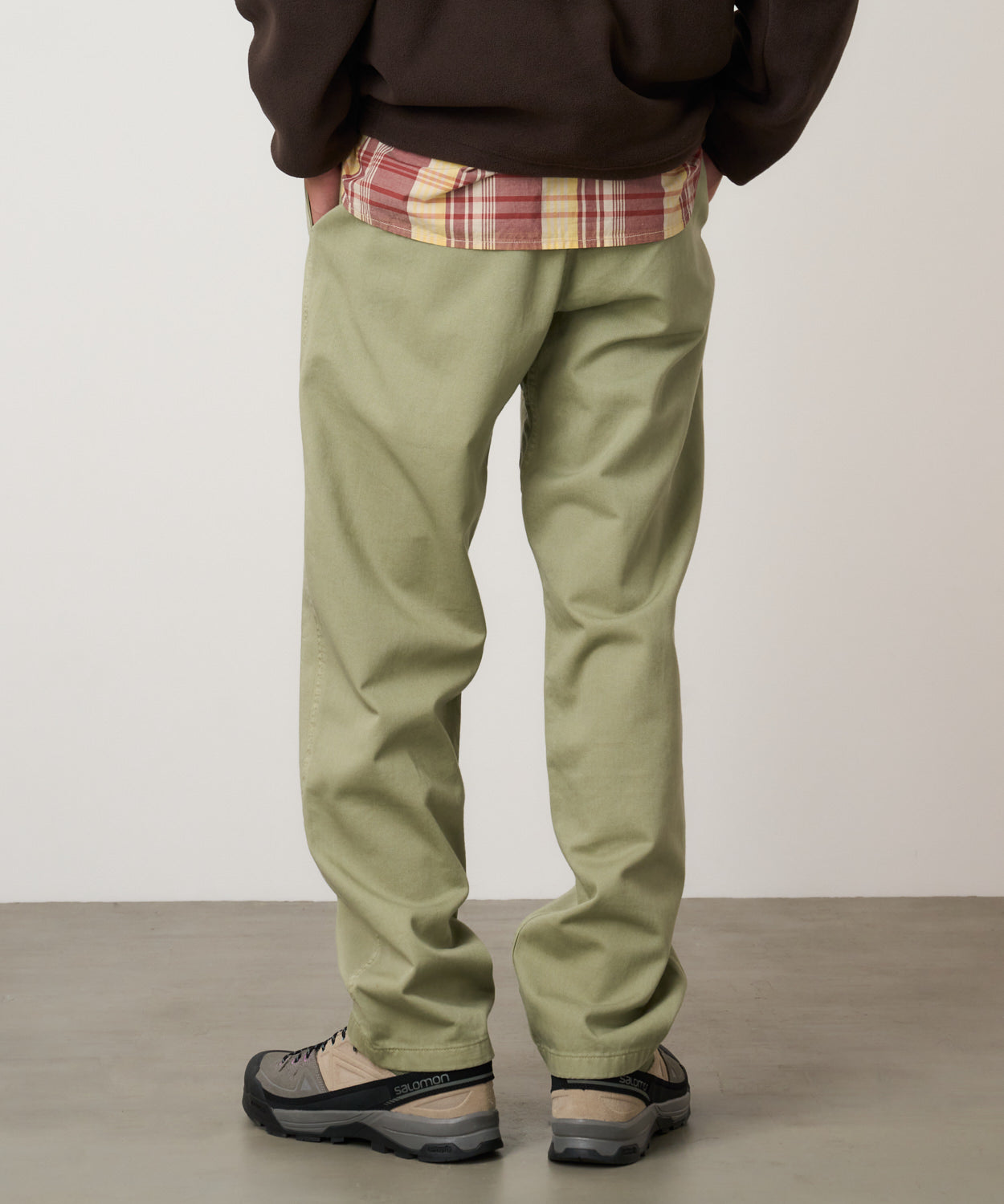 Model wearing Gramicci Pant Cactus Pigment relaxed fit cotton twill pants with cinch belt by LE.SHOP