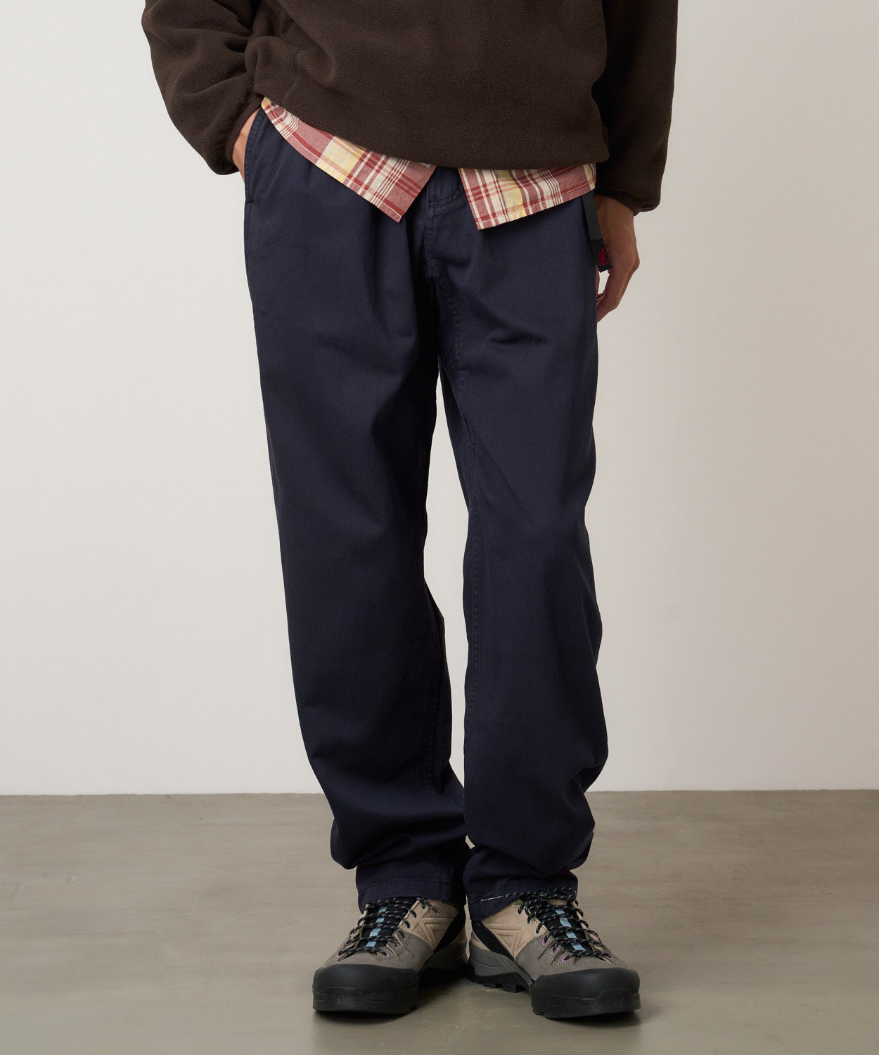 Model wearing Gramicci Pant Double Navy relaxed fit cotton twill pants with cinch belt by LE.SHOP