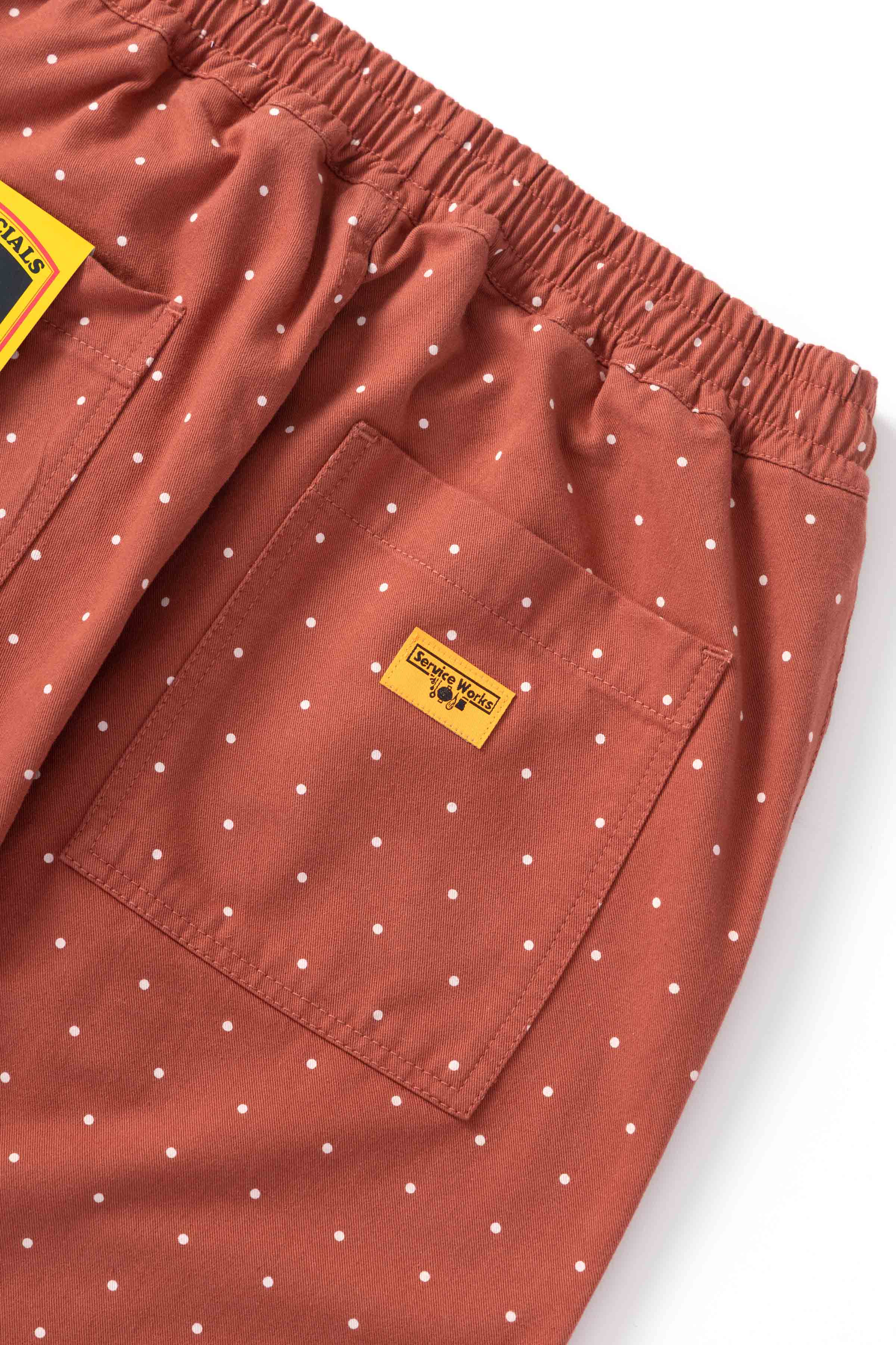 Detail view of clay Polka Dot Chef Pants highlighting organic cotton fabric, reinforced stitching and functional workwear pocket design