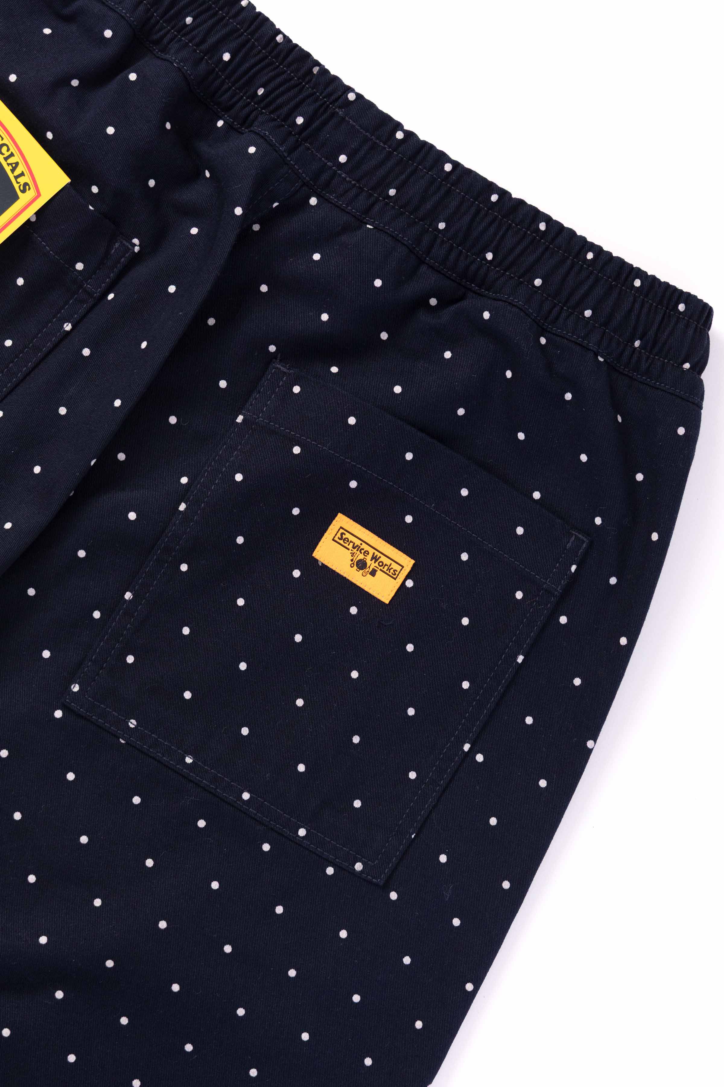 Model wearing navy Polka Dot Chef Shorts in relaxed fit featuring organic cotton fabric and versatile workwear-inspired streetwear style
