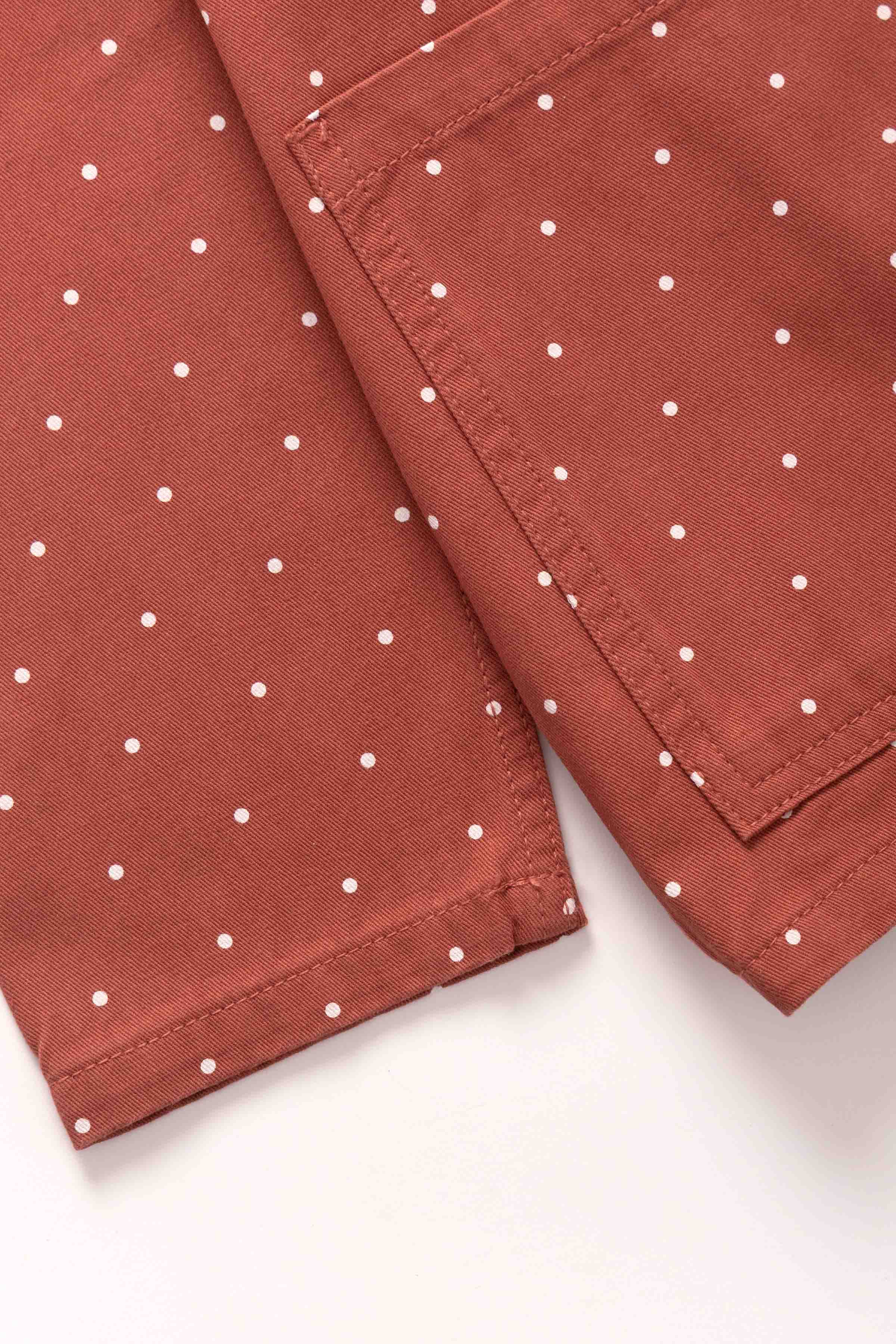 Lifestyle image of clay Polka Dot Chore Shirt featuring organic cotton fabric, relaxed workwear fit and versatile everyday styling