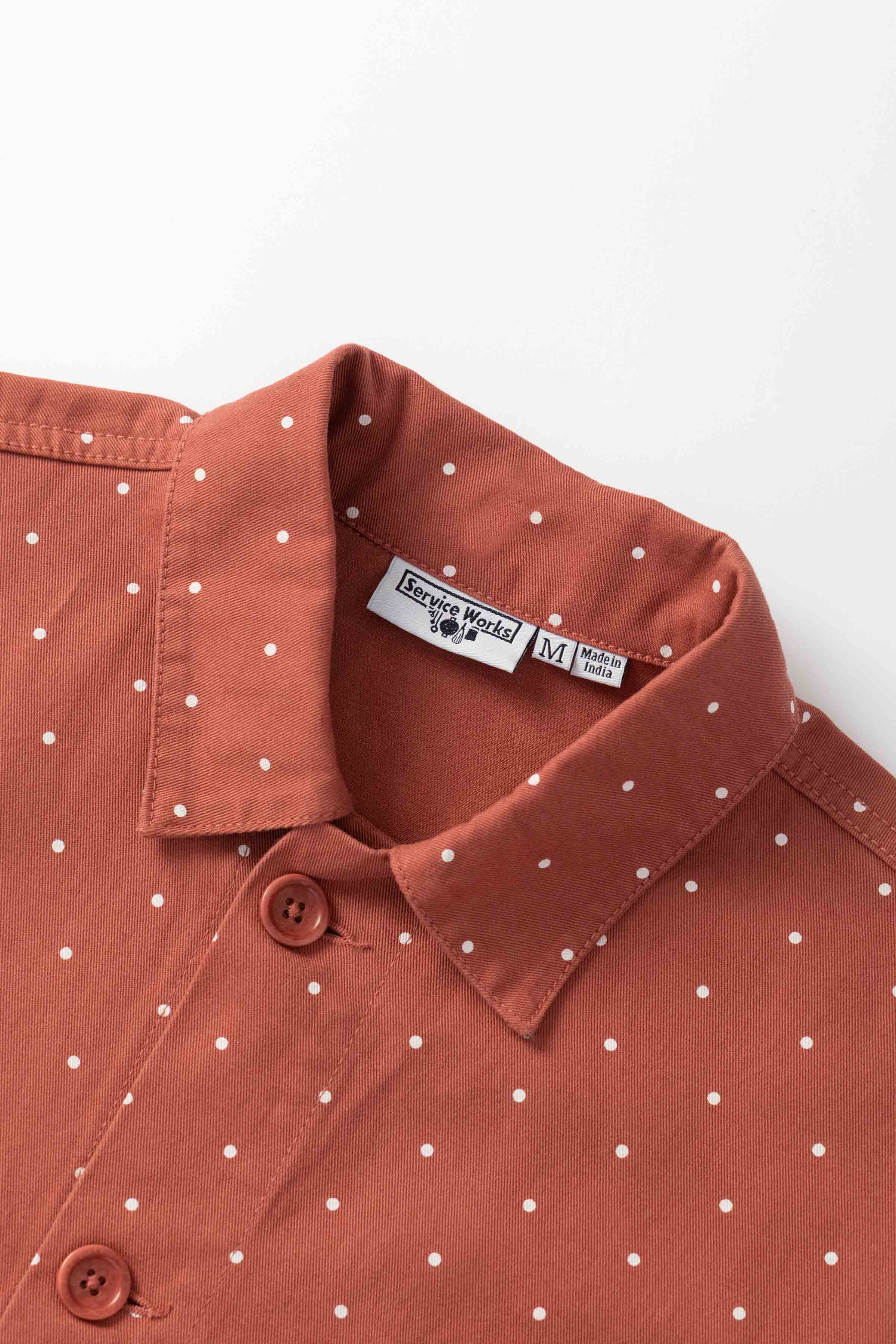 Model wearing clay Polka Dot Chore Shirt shown from back, featuring organic cotton fabric, clean silhouette and classic workwear styling
