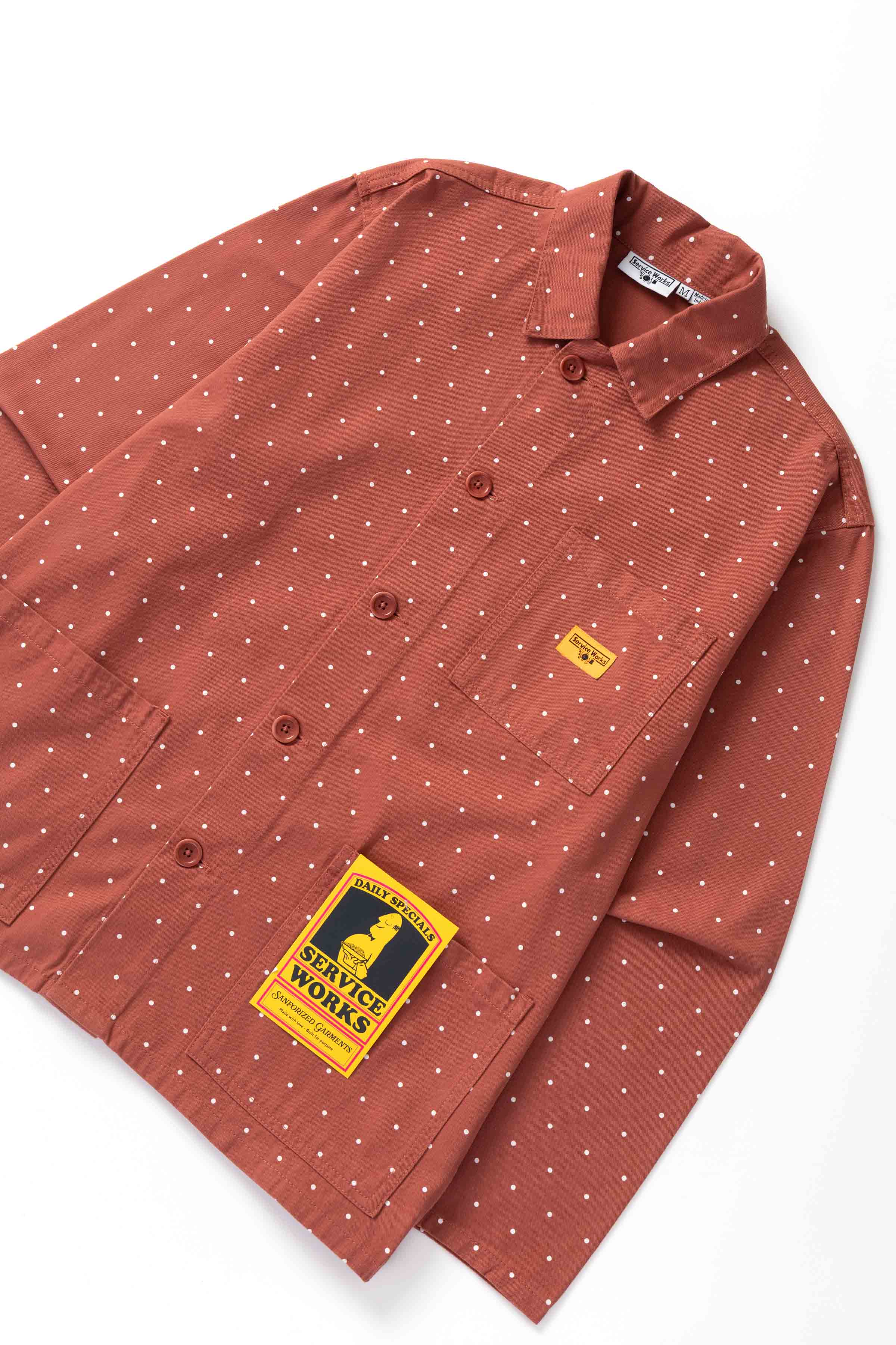 Front view of model wearing clay Polka Dot Chore Shirt featuring organic cotton fabric, utility pockets and timeless workwear styling