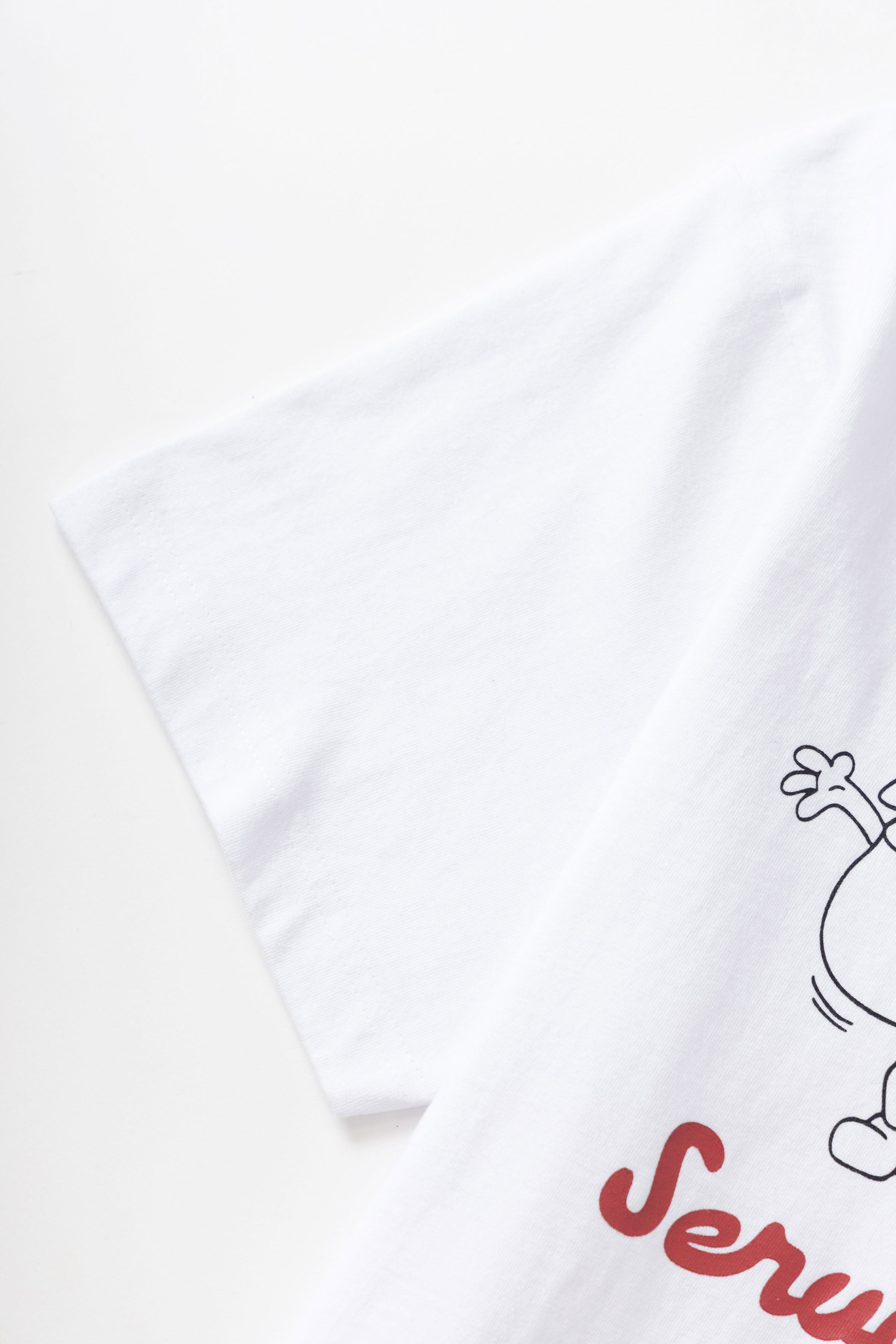 Model wearing white Pots & Pans graphic t-shirt shown from back, featuring organic cotton fabric, clean standard fit and everyday streetwear styling