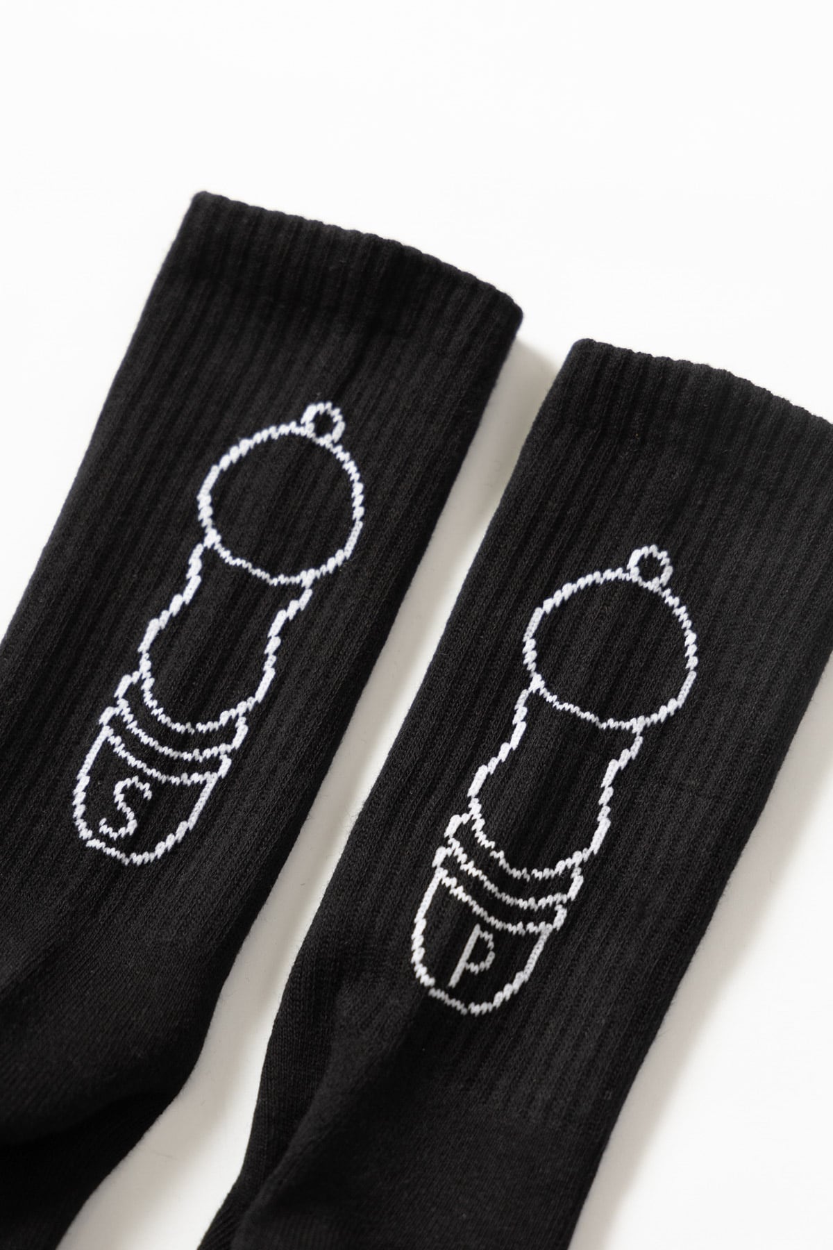 Black Salt + Pepper crew socks by Service Works, close-up streetwear socks with graphic design