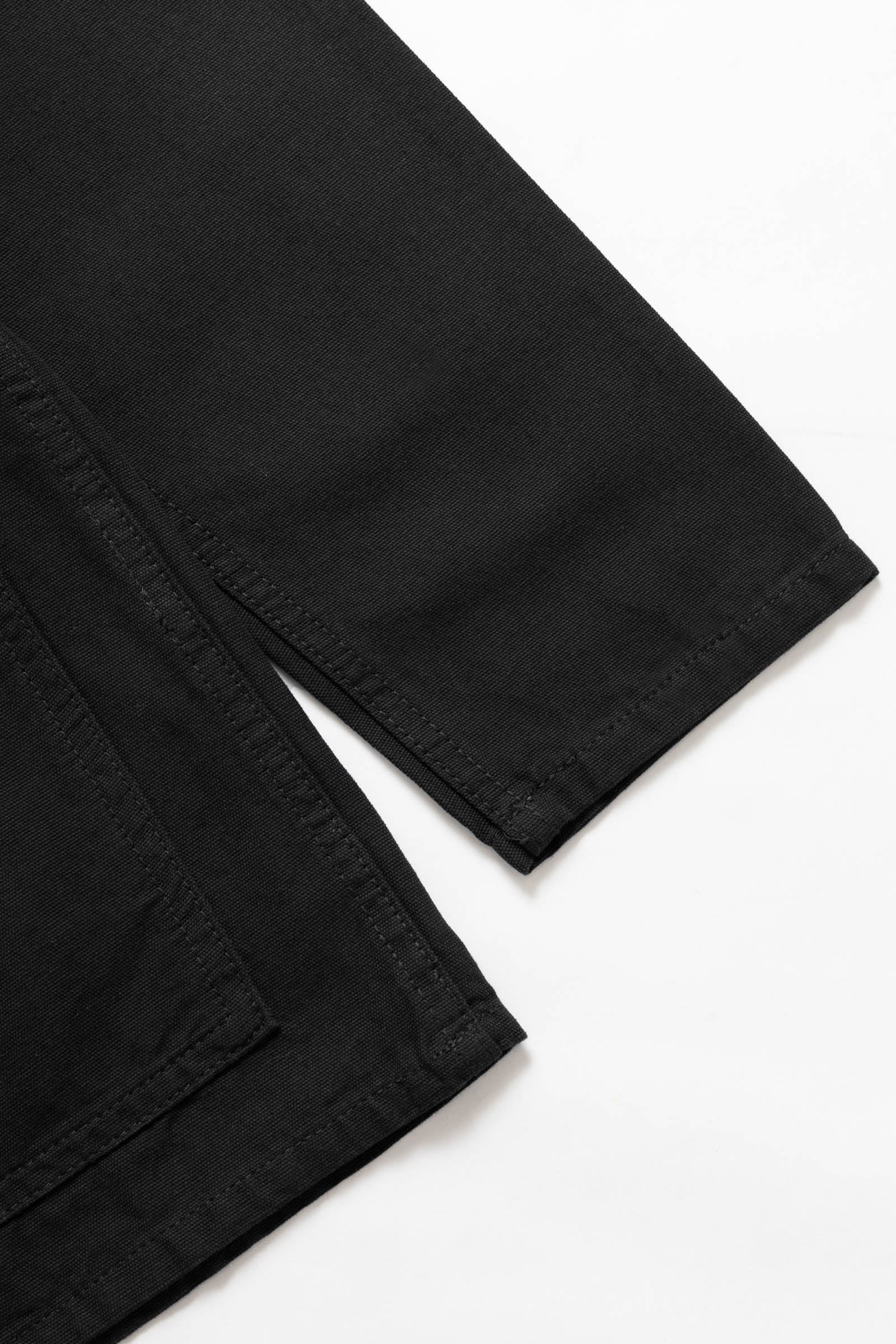 Back view of the Service Works Canvas Chore Shirt in Black featuring clean workwear design and structured canvas build.