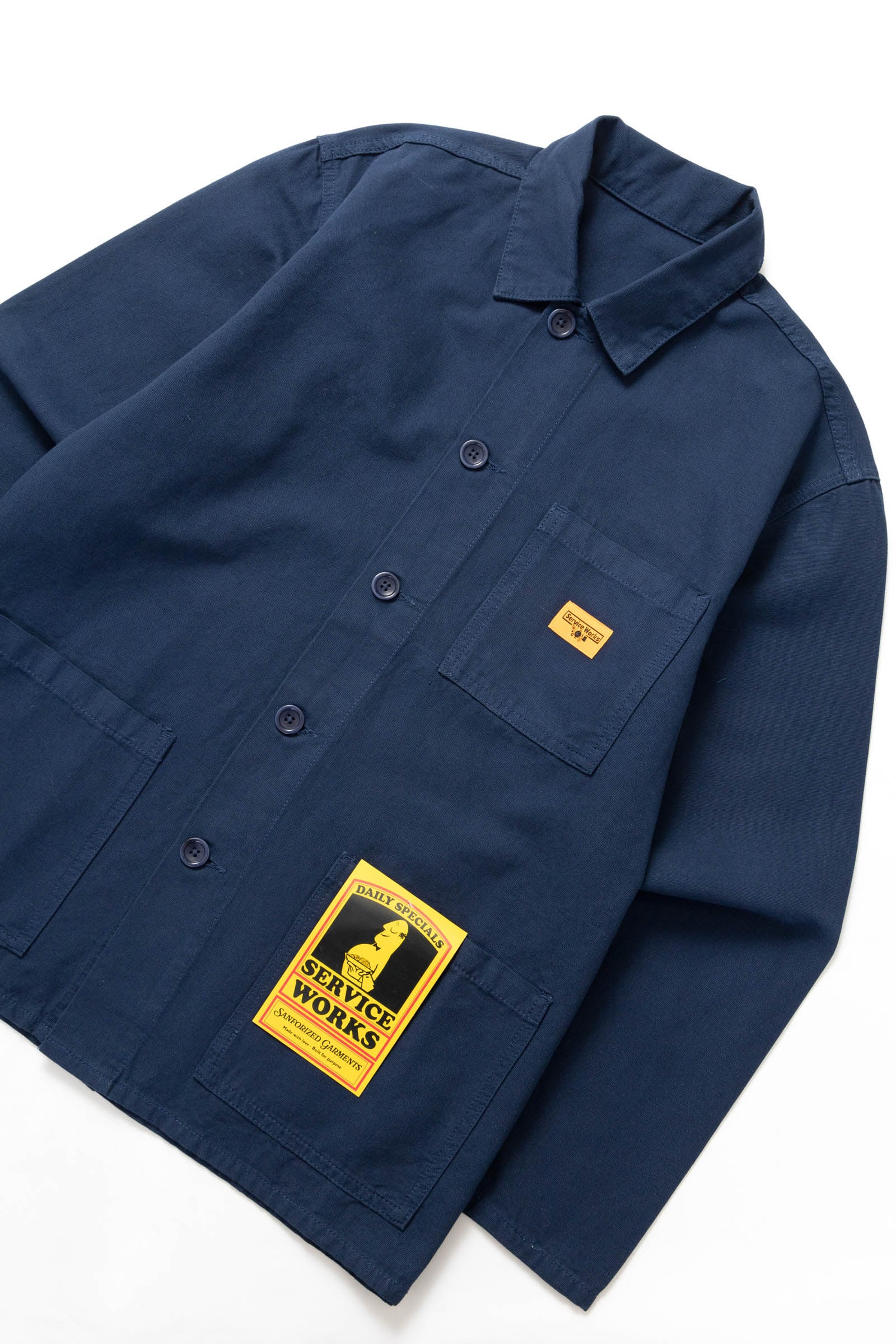 Side view of the Service Works Canvas Chore Shirt in Navy showing structured workwear fit and durable canvas fabric.