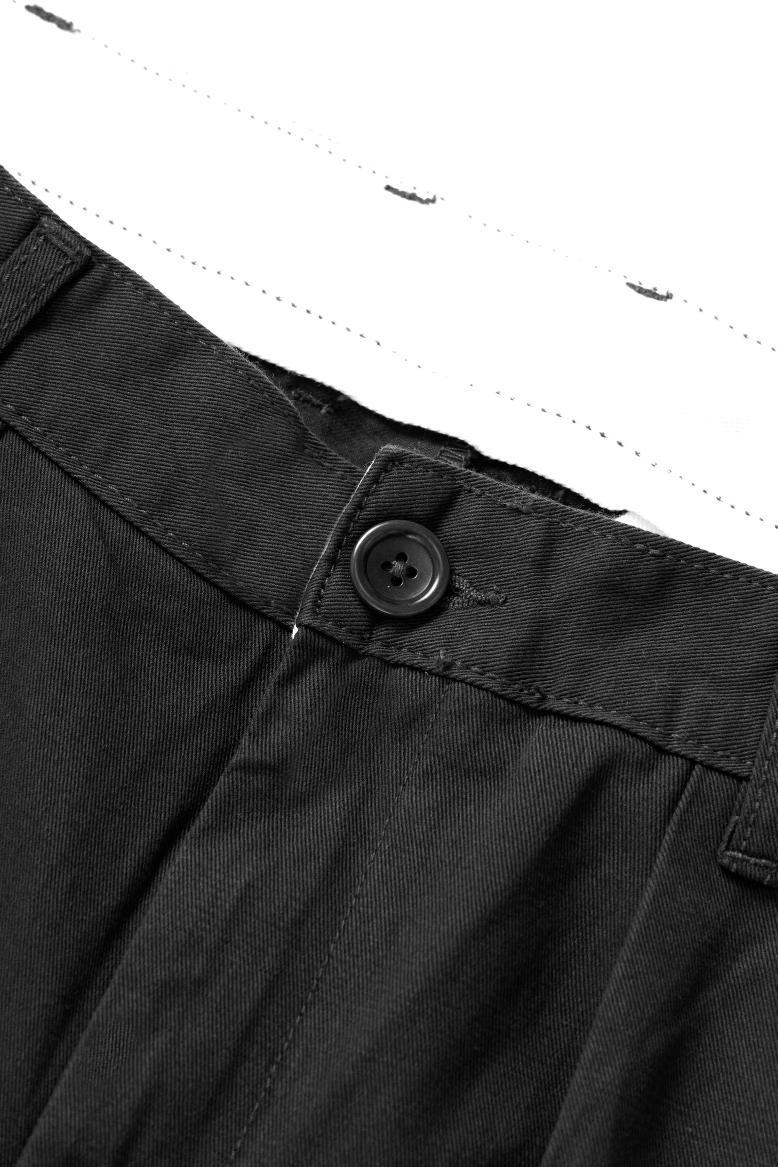 Close-up detail of the Service Works Drill Part Timer Pant in Black showing cotton drill fabric and double pleat construction.