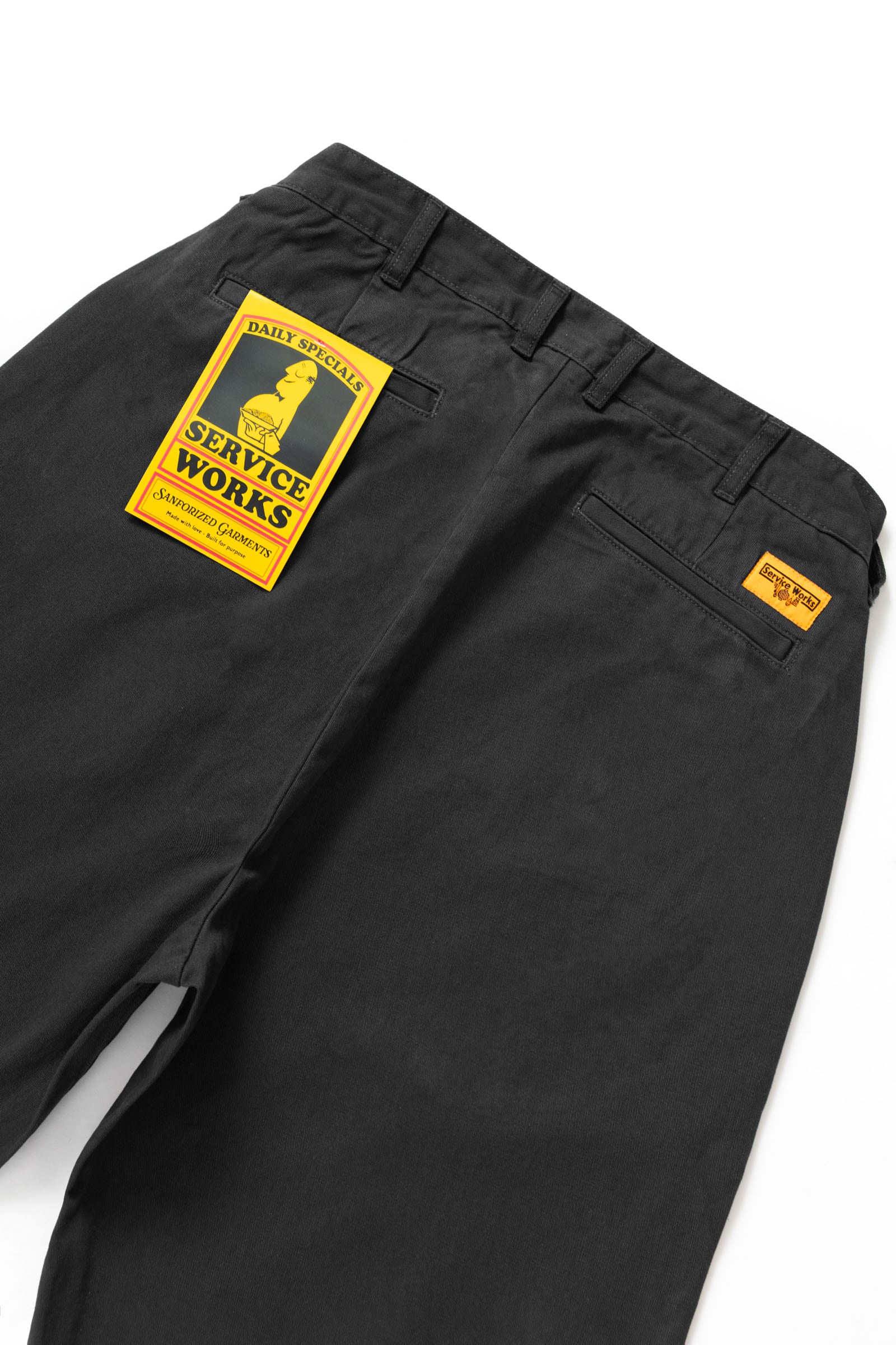 Close-up of the Service Works Drill Part Timer Pant in Black highlighting functional pocket design and reinforced stitching.