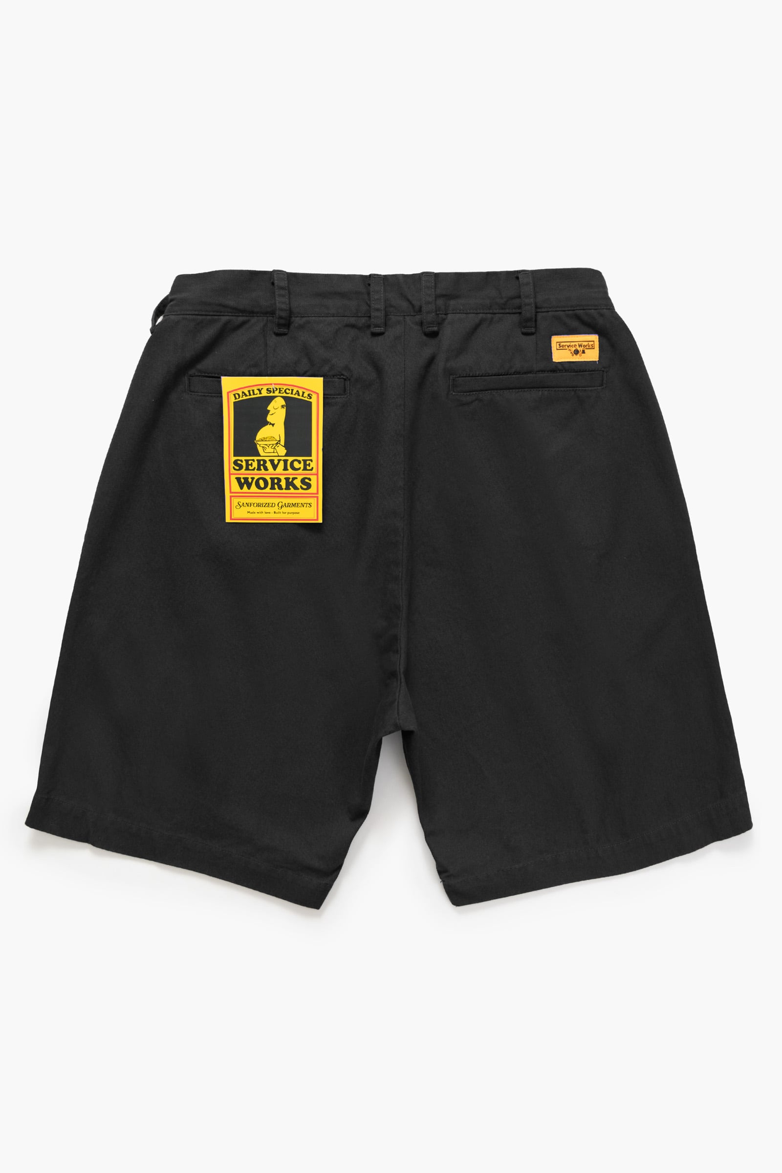 Close-up detail of the Service Works Drill Part Timer Short in Black showcasing the cotton drill fabric and signature woven label.
