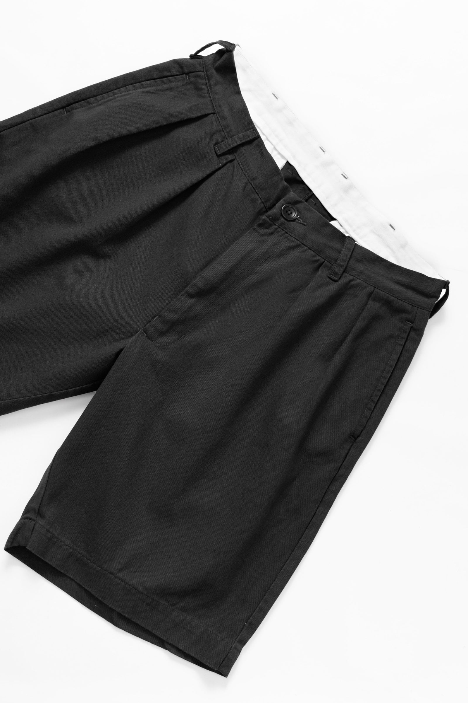 Side view of the Service Works Drill Part Timer Short in Black with a relaxed fit and durable cotton drill construction.