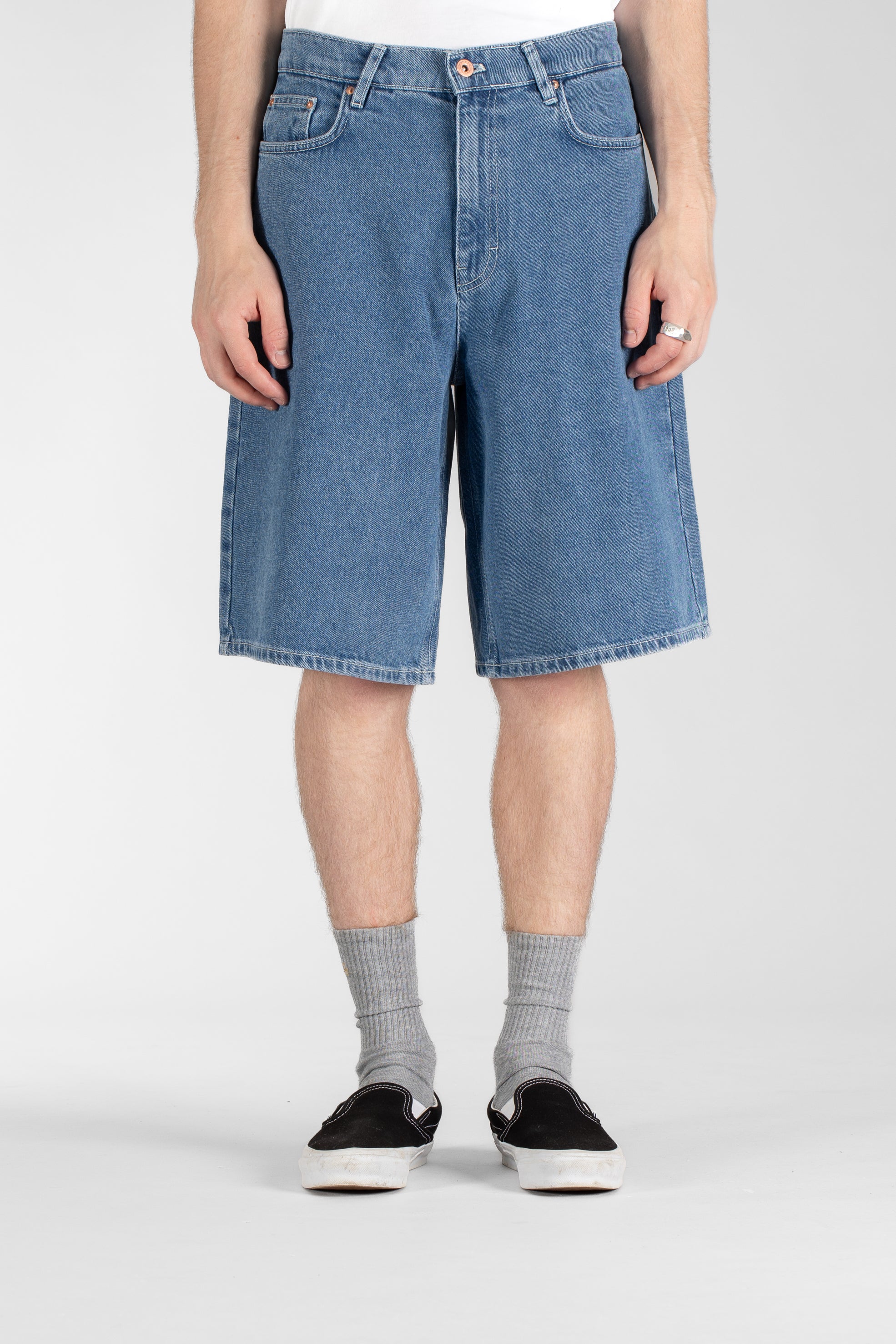 Front view of model wearing Stan Ray Wide 5 Short Mid Stone Denim made from heavyweight cotton denim with relaxed loose fit.