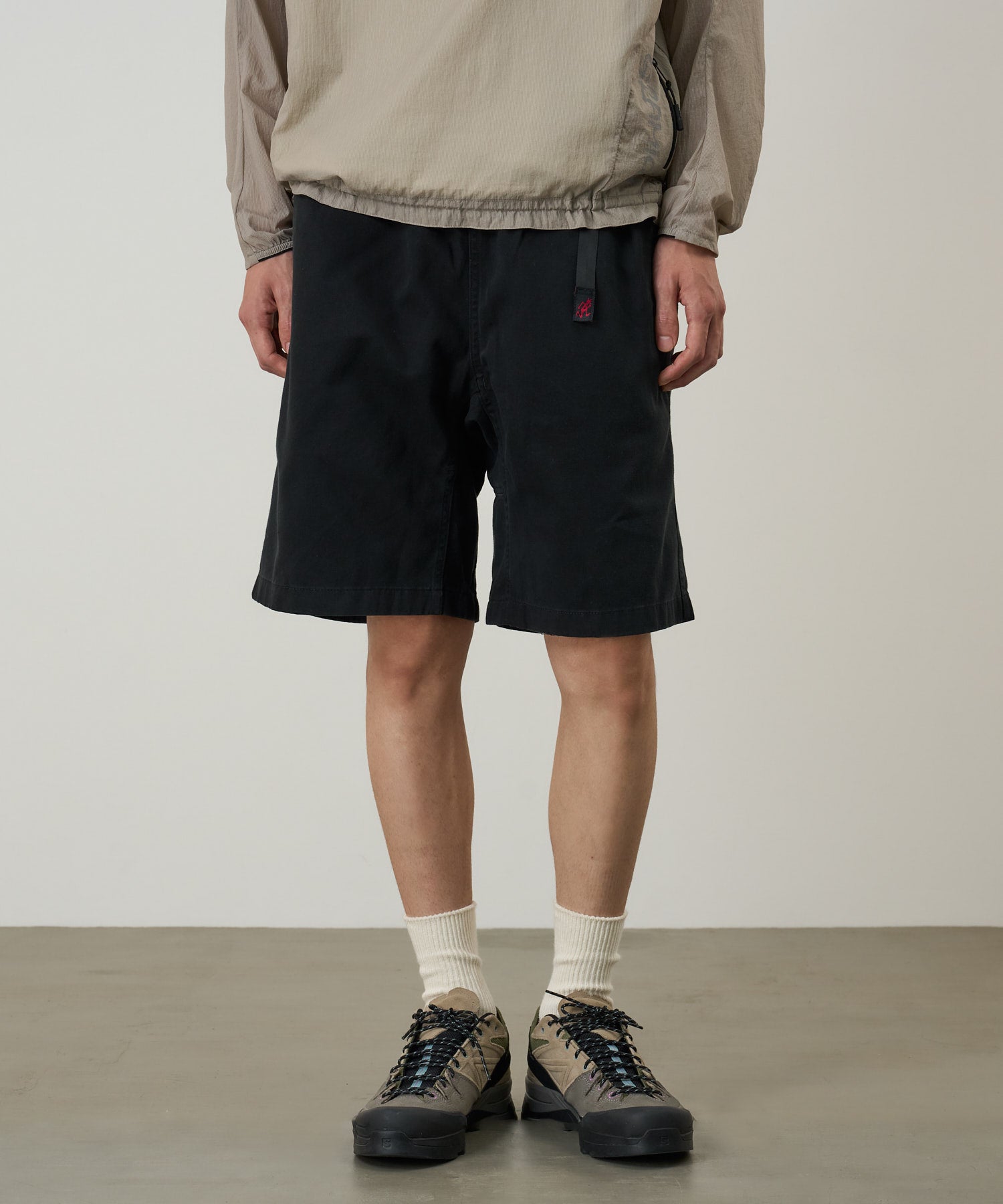 Back view of model wearing Tabi Sandal Black split-toe knit sandals with breathable tencel upper and Ortholite cushioned insole.