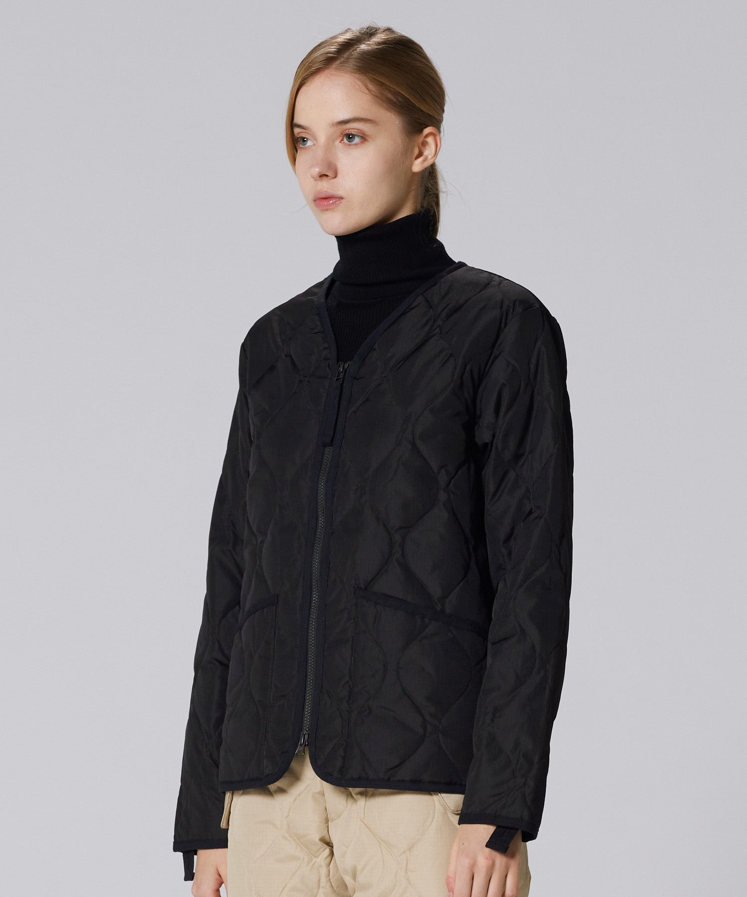 Model wearing Taion Military Zip V Neck Down Jacket in Black