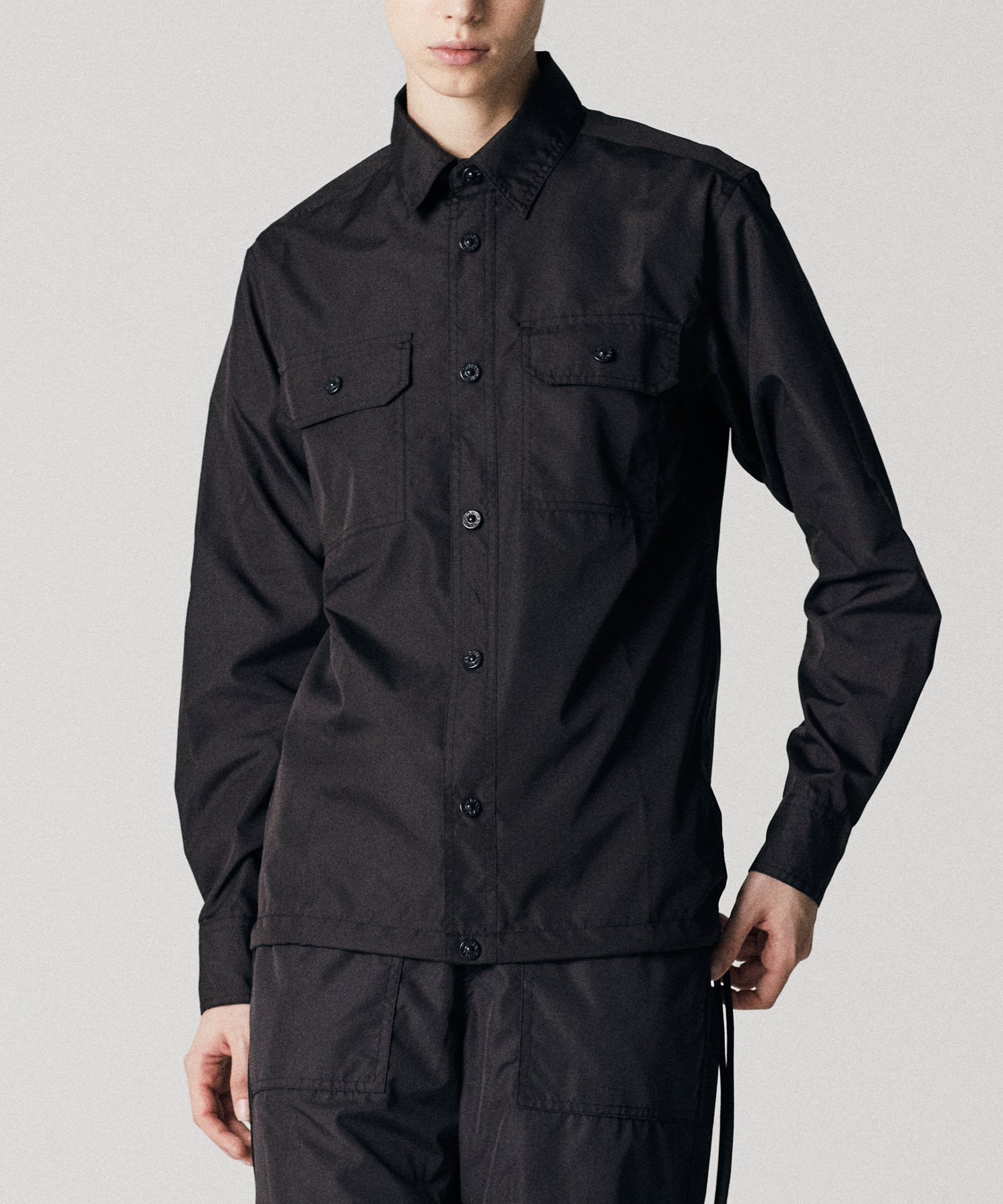 Taion Non Down Military Long Sleeve Shirt in Black – lightweight utility fabric with adjustable fit and everyday comfort