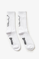 White crew socks with salt and pepper graphic worn on feet, showing front view and fabric detail