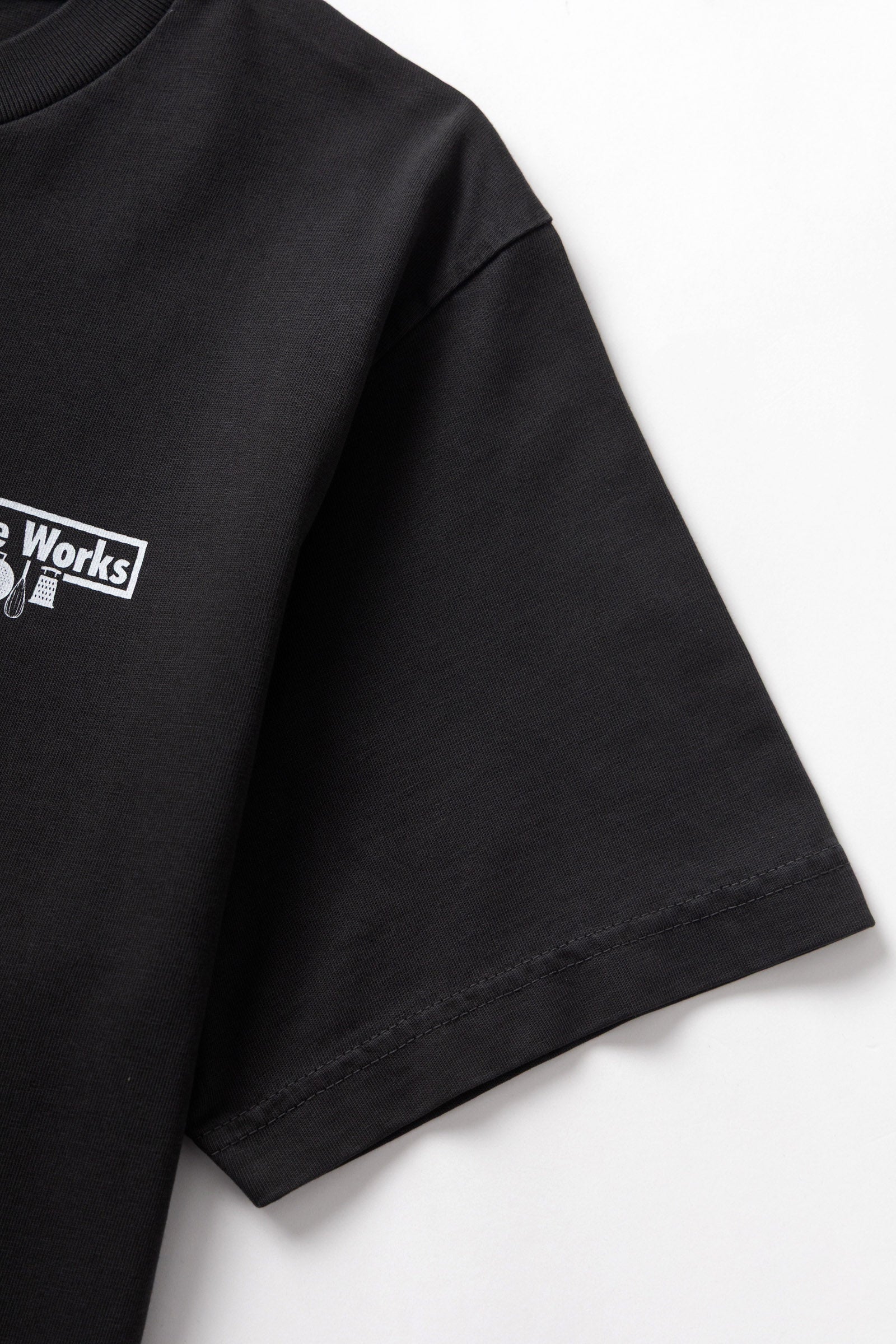 Black pigment dyed trademark tee front detail premium vintage streetwear washed fade cotton oversized t-shirt
