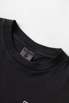 Black pigment dyed trademark tee lifestyle view premium vintage streetwear oversized fit washed cotton outfit