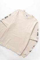 Natural cotton bootleg long sleeve tee side view modern streetwear relaxed fit