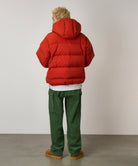 Back view of model wearing Brockton Big Corduroy Pant in Pine Green with wide-wale corduroy fabric, cargo pockets and relaxed fit silhouette