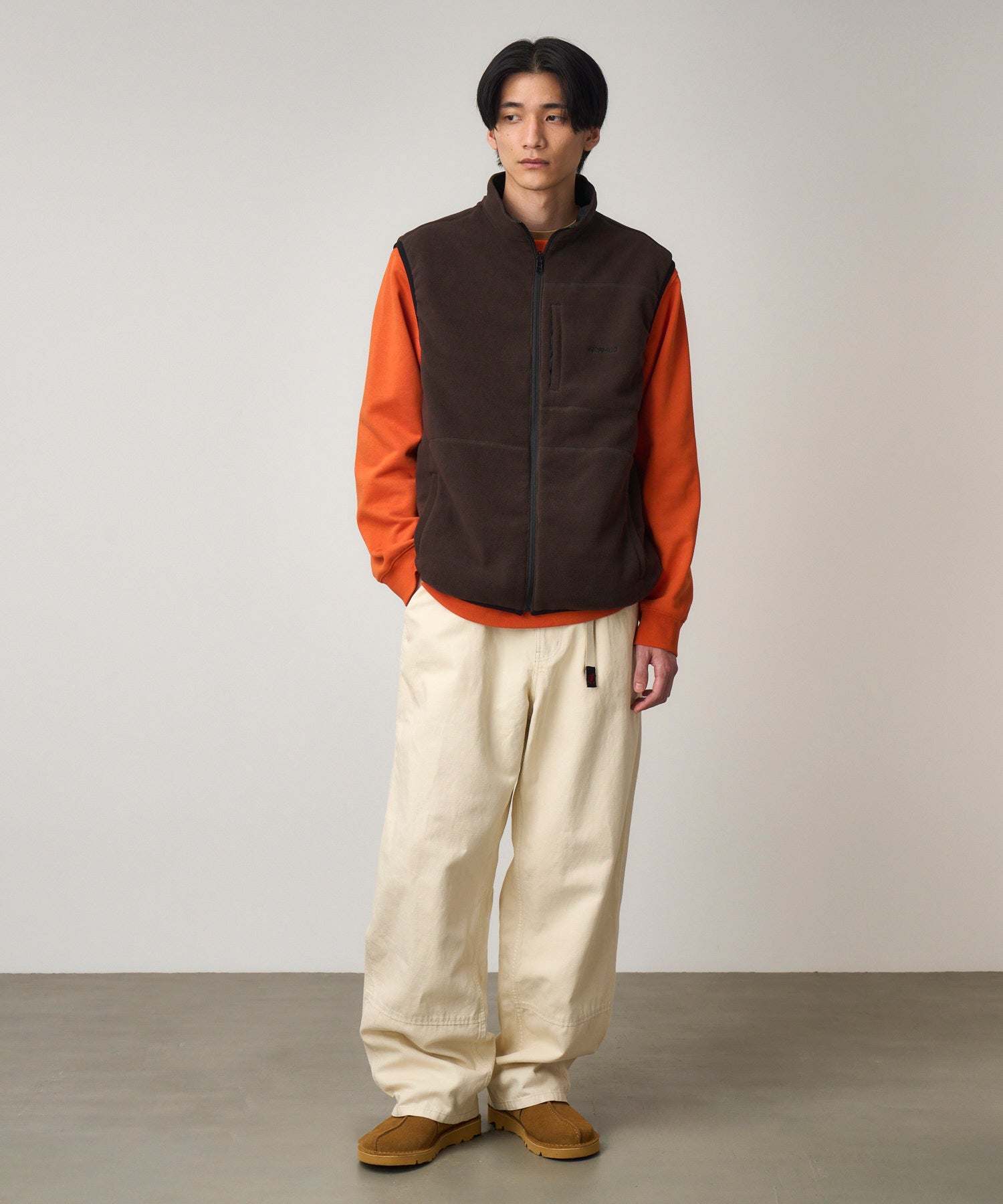 Front view of model wearing bone canvas work pants with relaxed fit and durable hemp-cotton utility construction for everyday wear