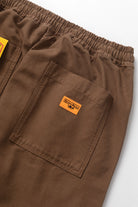 Model wearing bark chef pants in cotton canvas lifestyle view