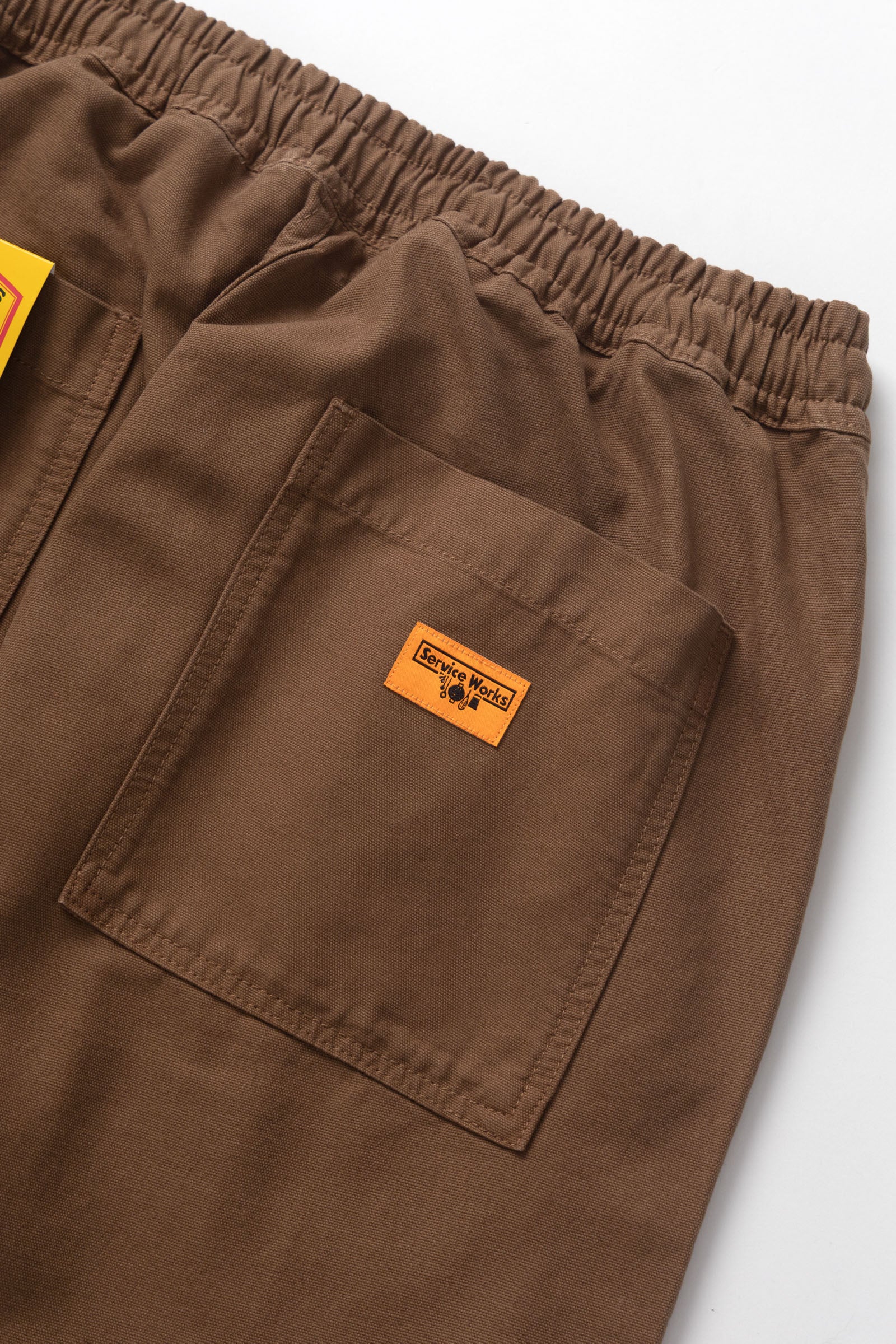 Model wearing bark chef pants in cotton canvas lifestyle view