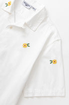 White cross stitch shirt front detail premium cotton urban streetwear design close up