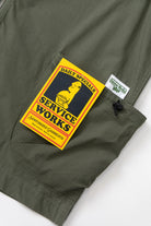 Olive utility vest back view with organic cotton fabric and stitching detail
