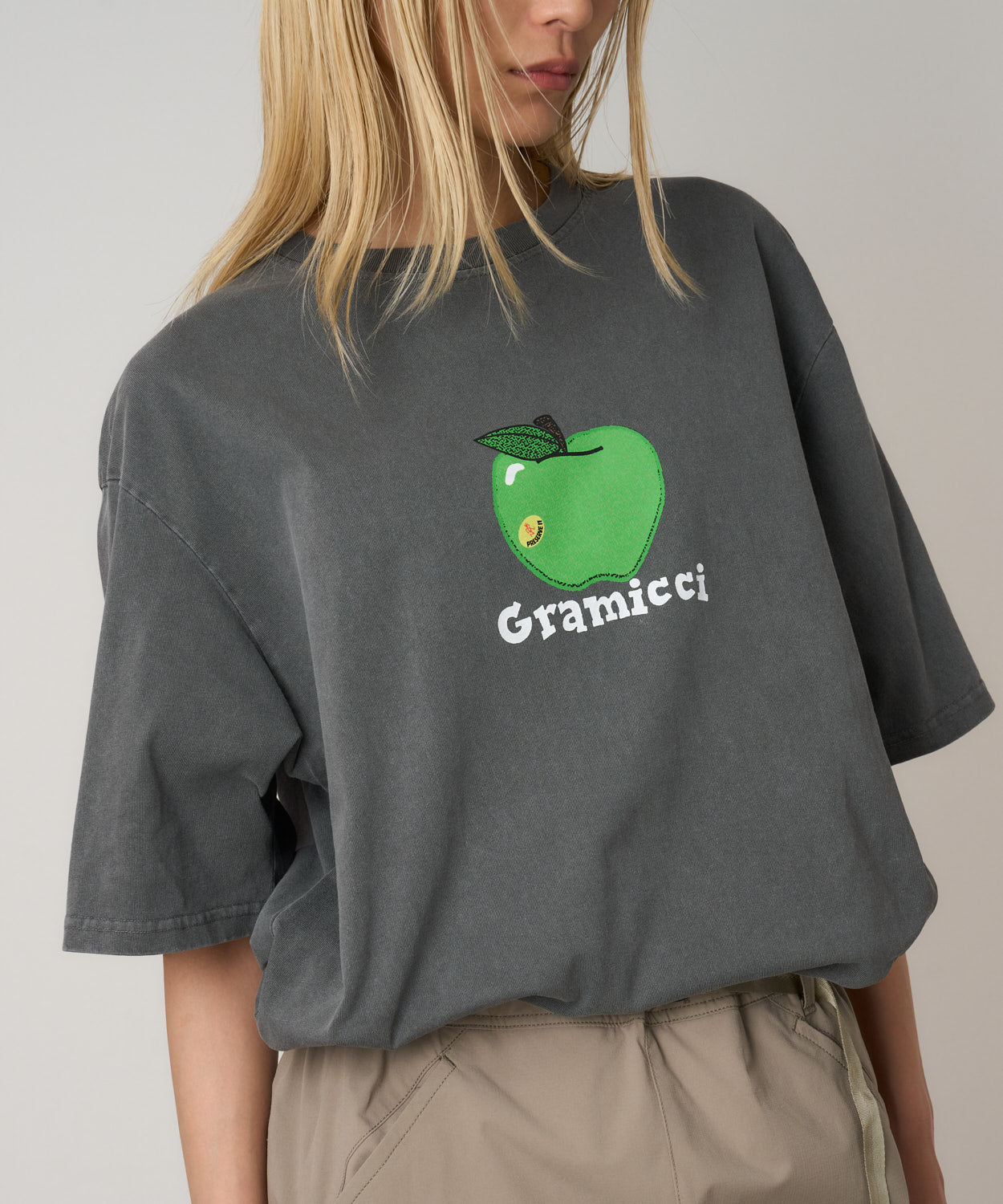 Gramicci Apple Tee in Charcoal Pigment worn on model showing relaxed streetwear fit