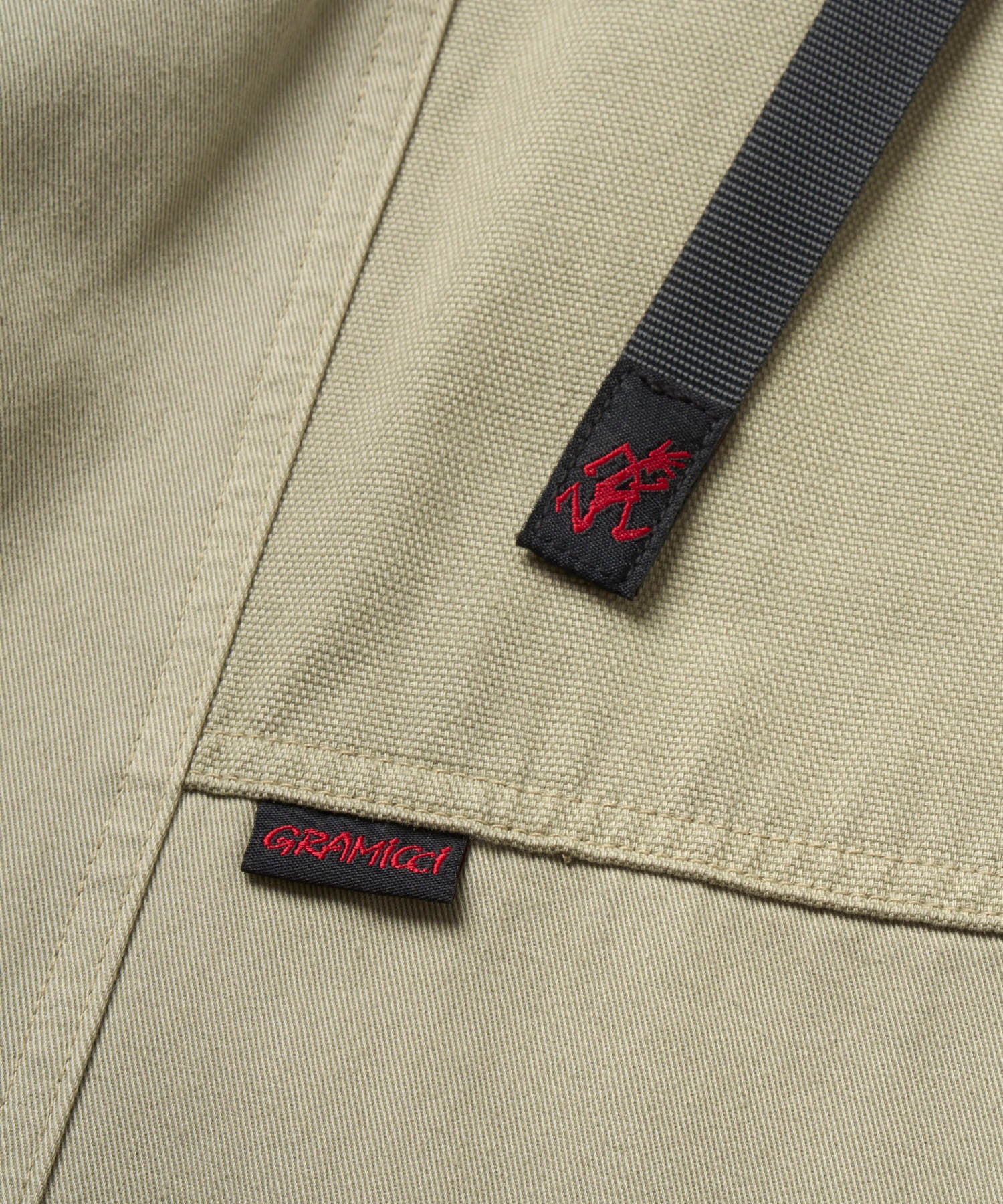 Close-up of the back pocket on Gramicci Gadget Pant Dried Sage with durable stitching and utility design