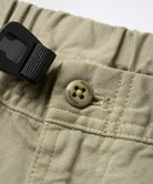 Close-up of Gramicci Gadget Pant Dried Sage featuring the signature Gramicci logo and premium finishing details
