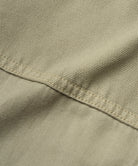 Close-up of Gramicci Gadget Pant Dried Sage wrap-around utility pocket with durable cotton twill fabric