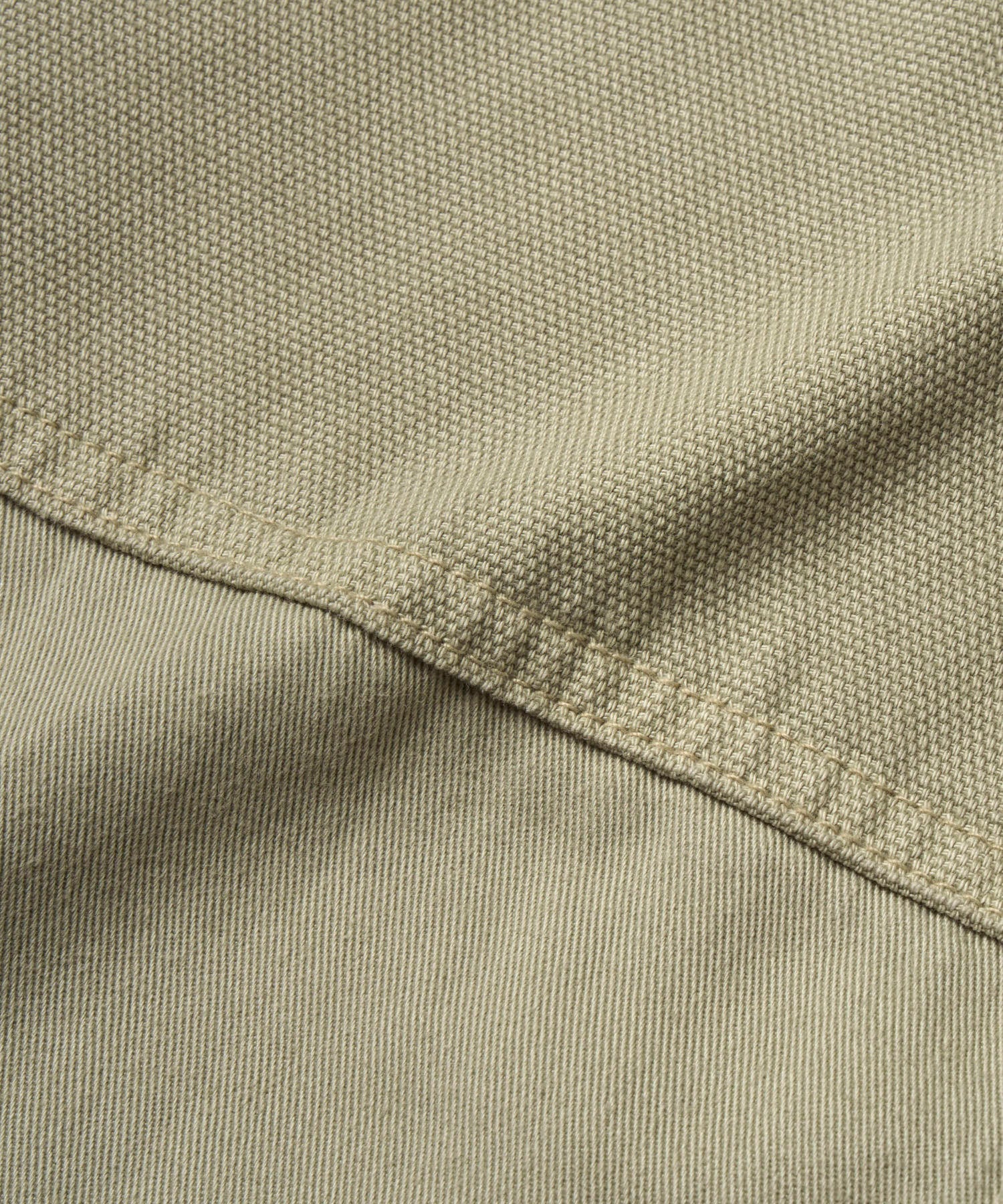 Close-up of Gramicci Gadget Pant Dried Sage wrap-around utility pocket with durable cotton twill fabric