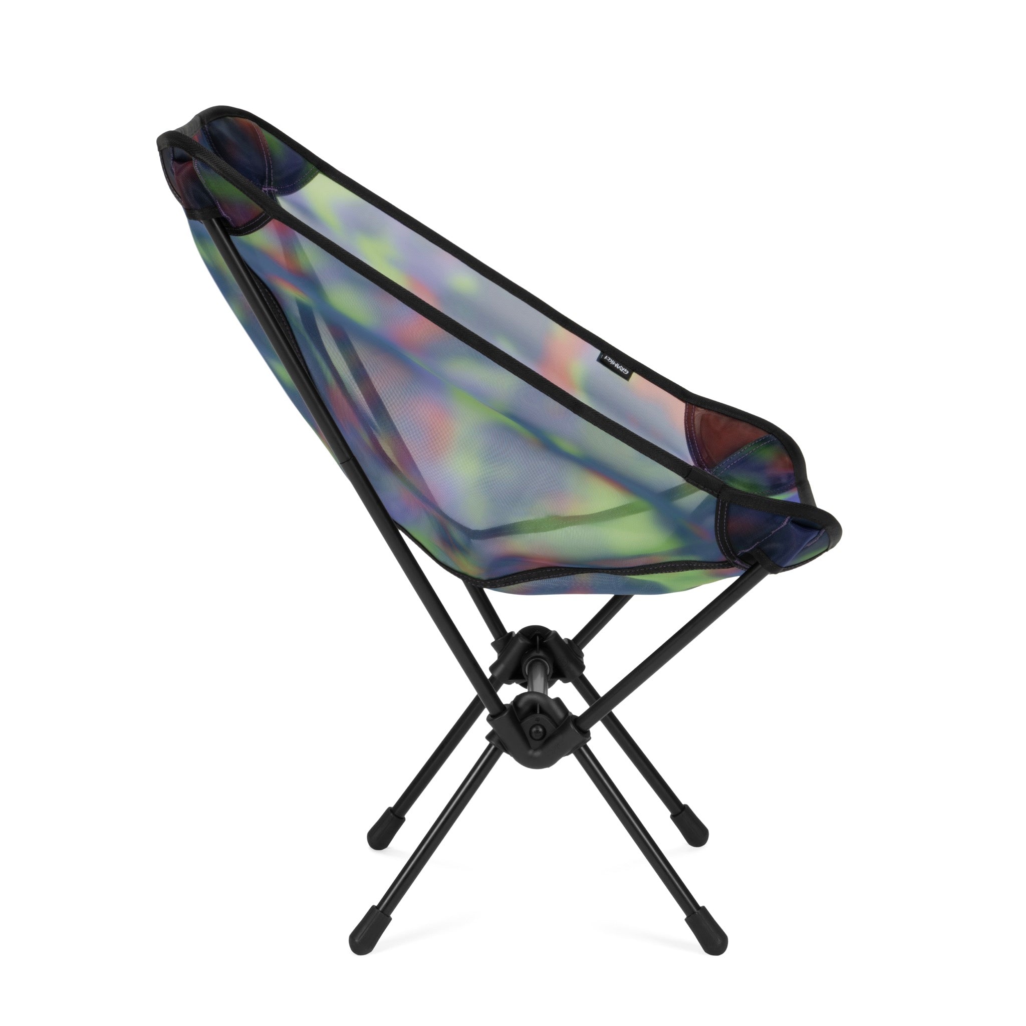 Angled view of Gramicci & Helinox Chair One in camo featuring lightweight portable frame and tie-dyed mesh fabric design