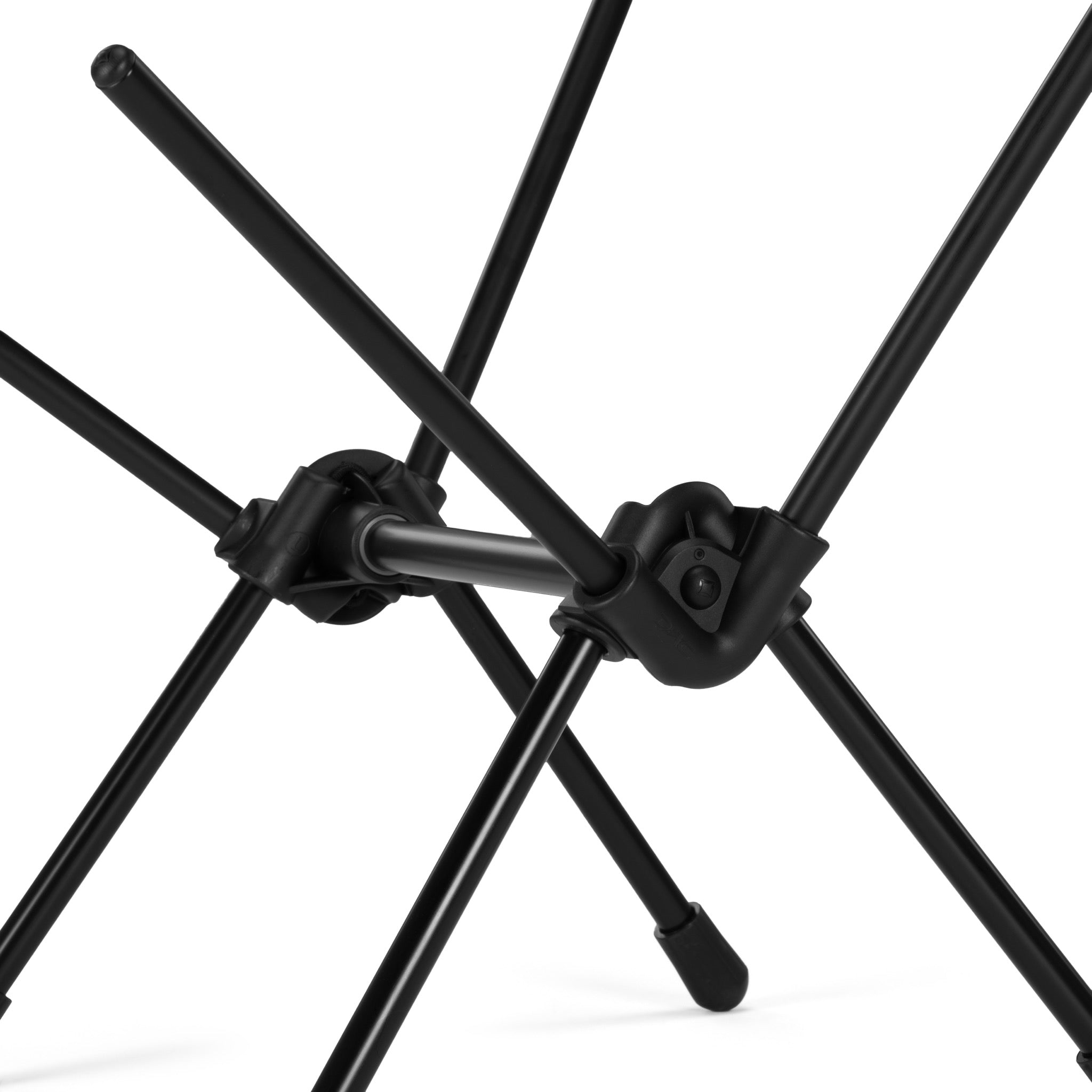 Close-up detail of Gramicci & Helinox Chair One in camo showing lightweight frame and tie-dyed mesh fabric construction