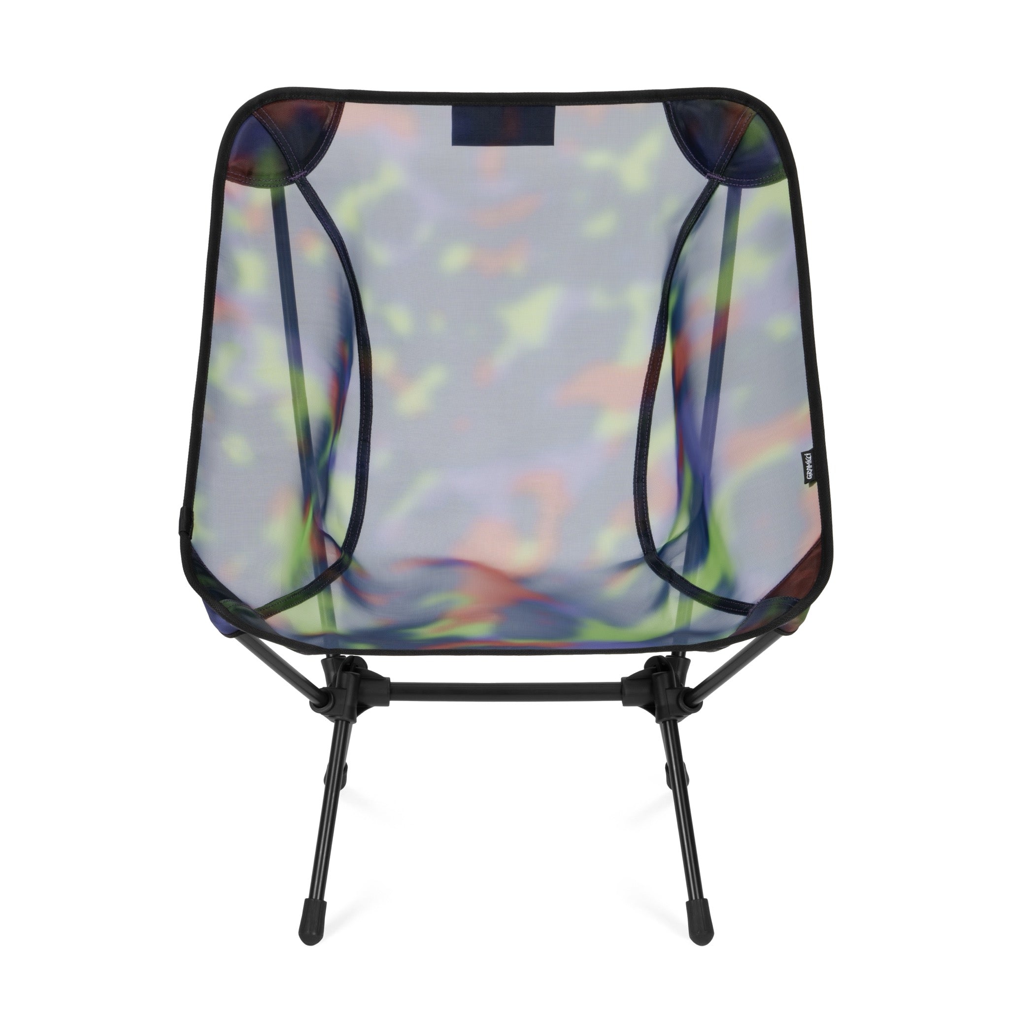 Side view of Gramicci & Helinox Chair One in camo featuring lightweight portable construction and tie-dyed mesh design