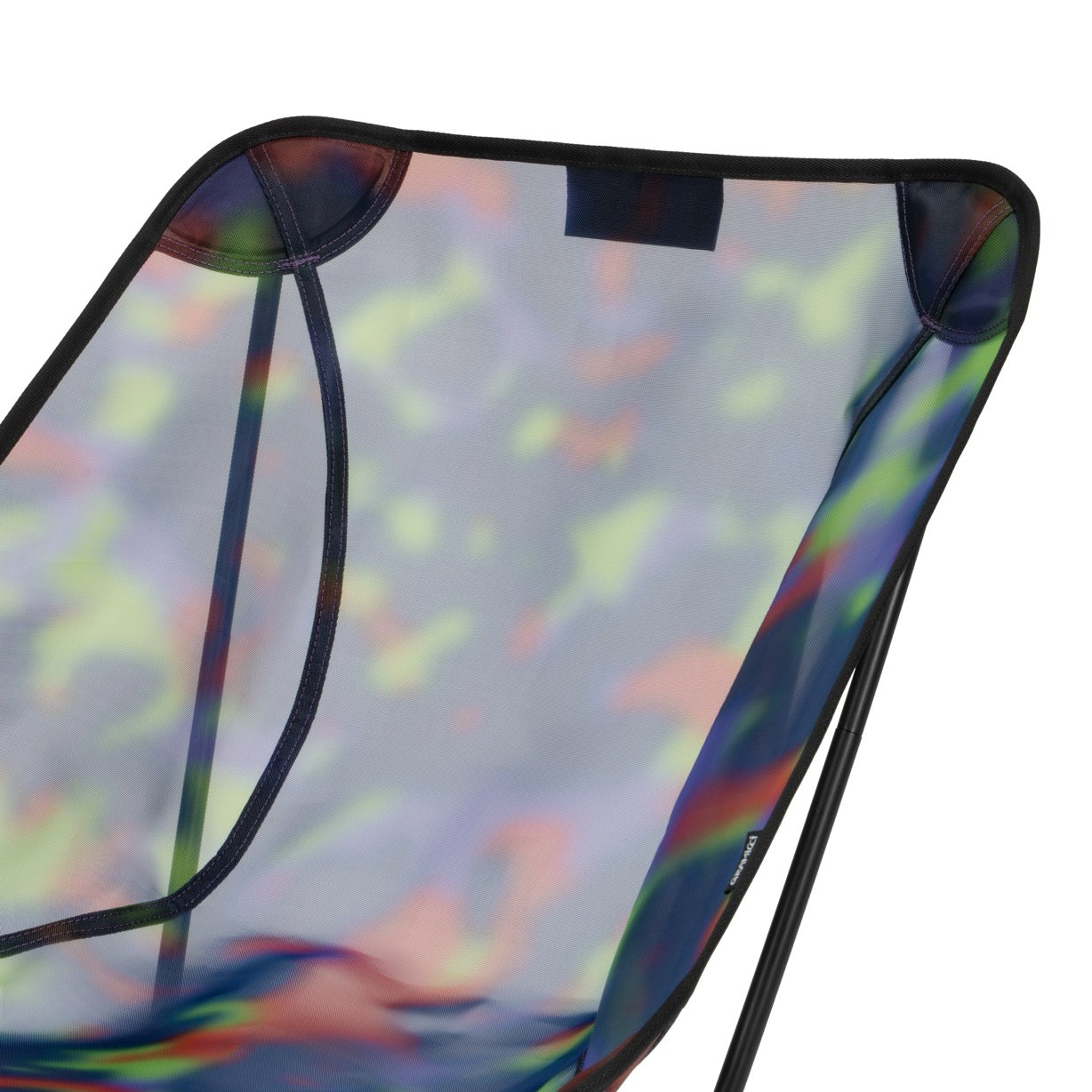 Detail view of Gramicci & Helinox Chair One in camo showing lightweight frame construction and tie-dyed mesh fabric design