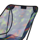 Detail view of Gramicci & Helinox Chair One in camo showing lightweight frame construction and tie-dyed mesh fabric design