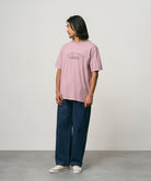 Side view of model wearing Gramicci Livin Tee Lilac Pigment cotton T-shirt