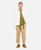 Side view of model wearing Gramicci Loose Tapered Pant US Chino with relaxed fit, eco cotton twill fabric and tapered cropped leg for everyday comfort.